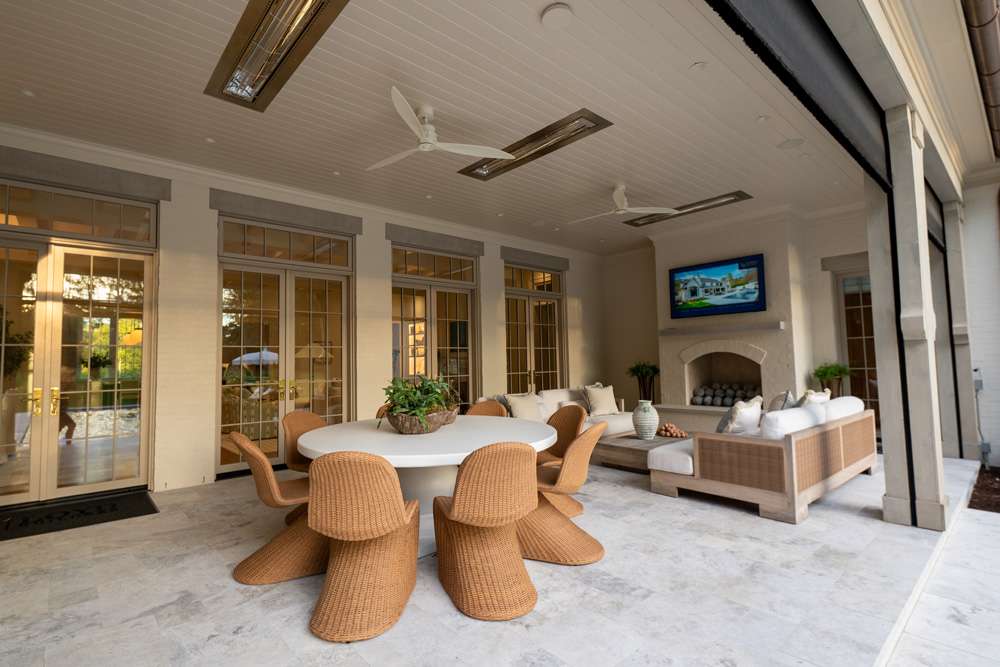 Outdoor eating area and seating with TV on a home patio