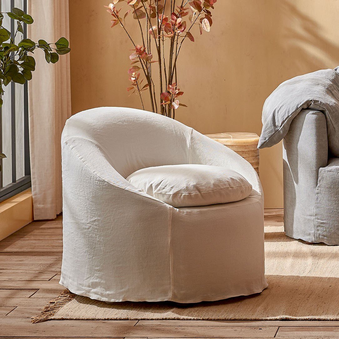 Ozzi Chair in Water Lily, a white Light Weight Linen with warm undertones
