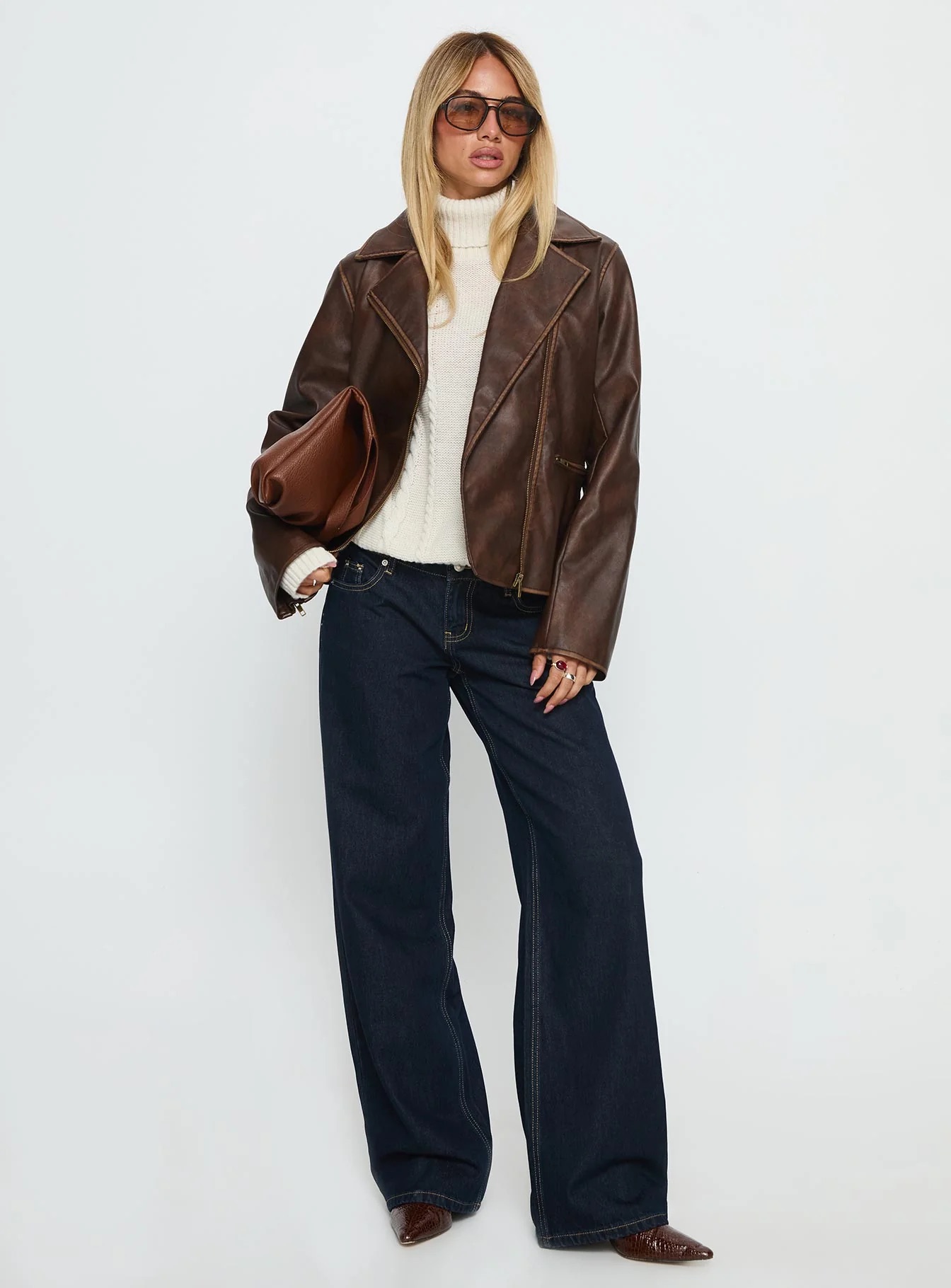 woman wearing faux leather collared jacket for winter date night