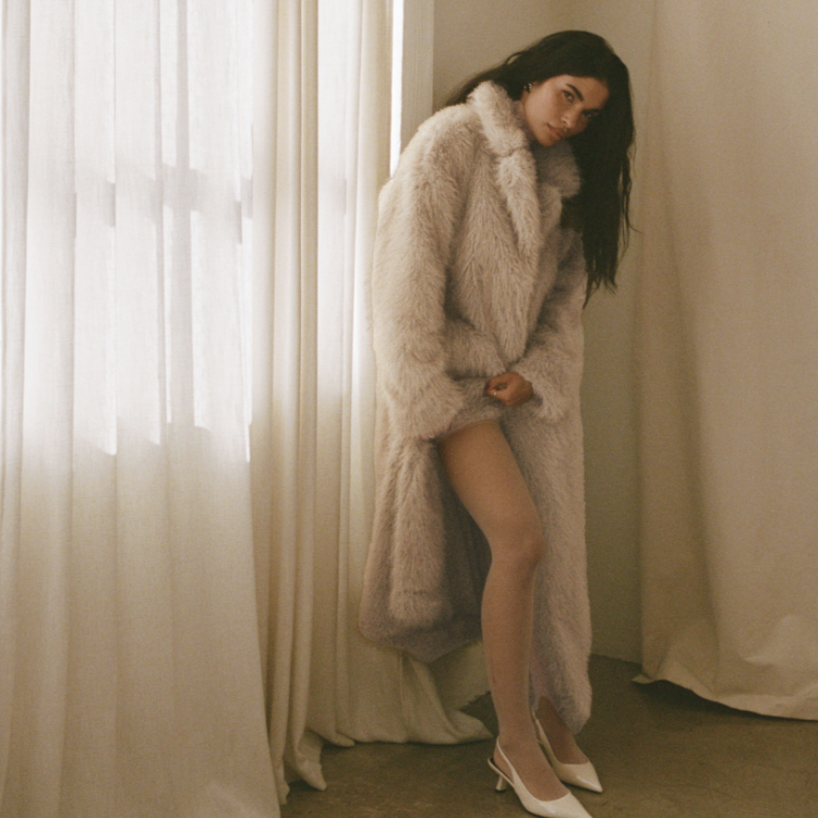 woman wearing faux fur coat for winter date night