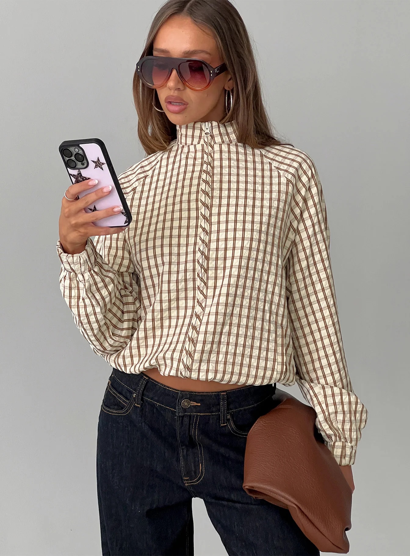 woman wearing princess polly funnel neck jacket - winter 2025 fashion trends