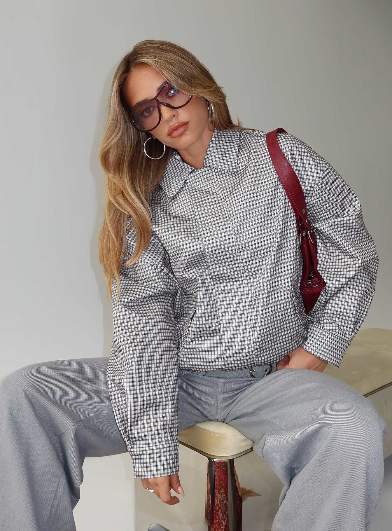 woman wearing princess polly check bomber jacket - winter 2025 fashion trends