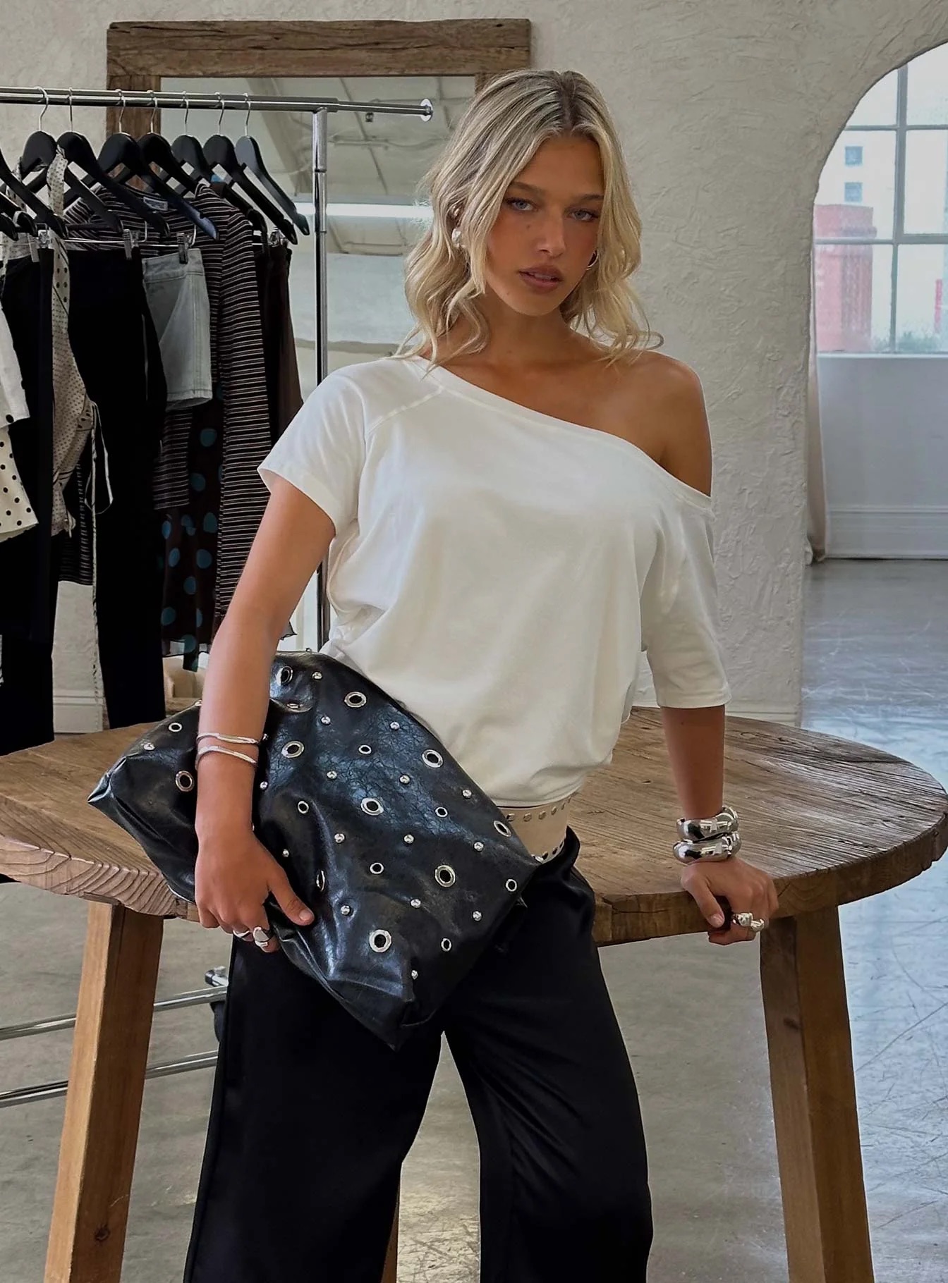 woman wearing princess polly eyelet bag - winter 2025 fashion trends