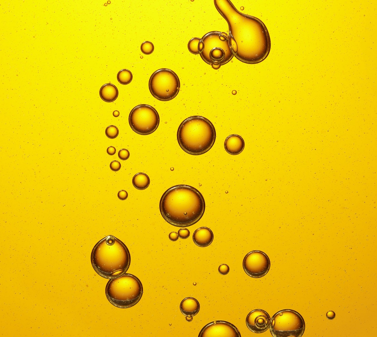 Close-up shot of yellow-tinted oil