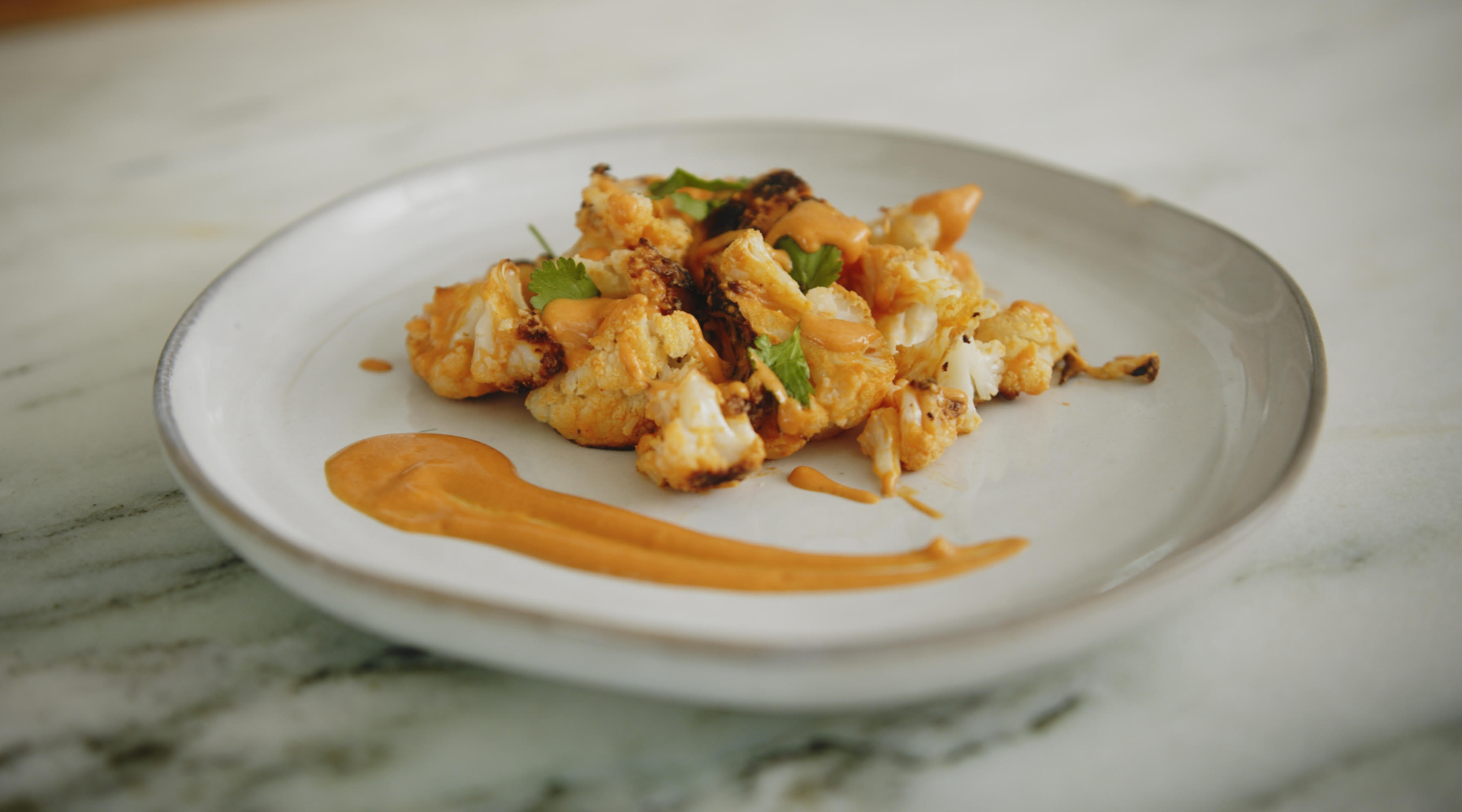 CRISPY CAULIFLOWER BITES WITH HOMEMADE BUFFALO SAUCE