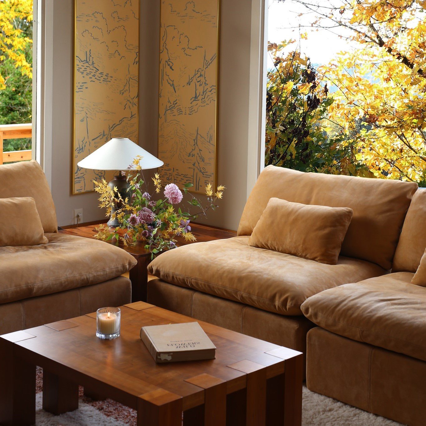 @hart_floral's Aria Leather Chaise Sectional in Mojave Glow, Meridian Leather placed in a sunlit room facing a coffee table