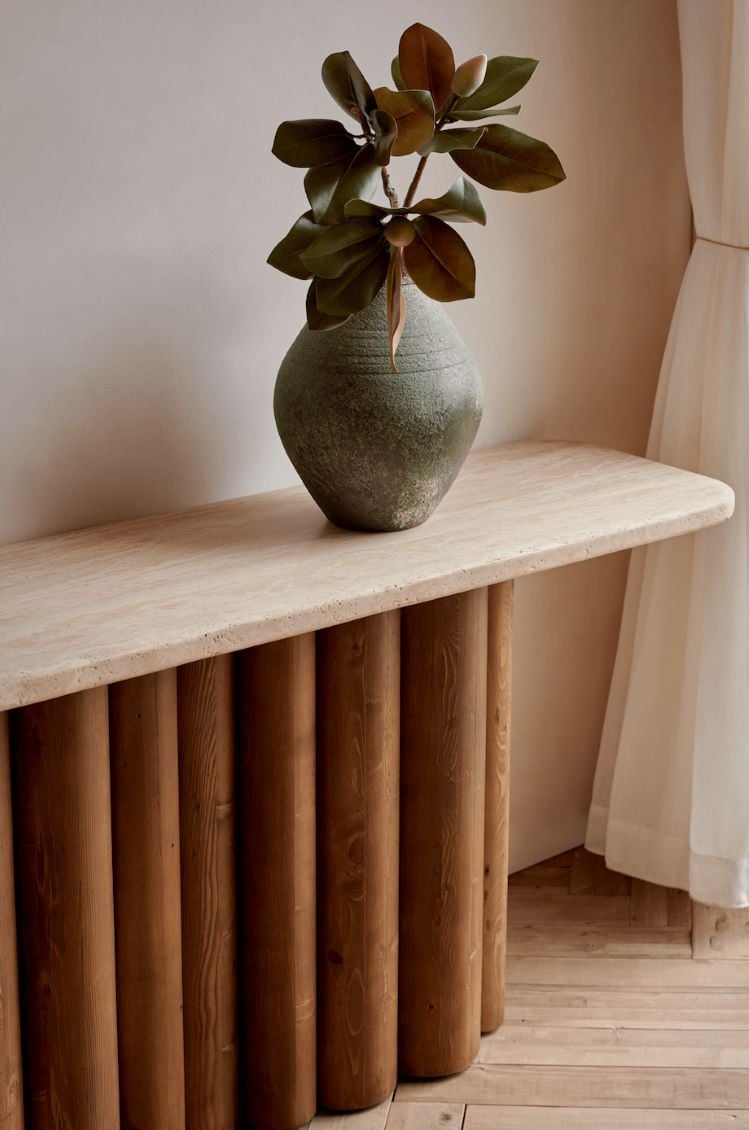 Cordelia Console Table in Galata Travertine & Reclaimed Pine with a potted plant placed on the surface