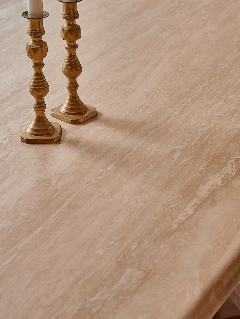 Candlesticks on a travertine tabletop