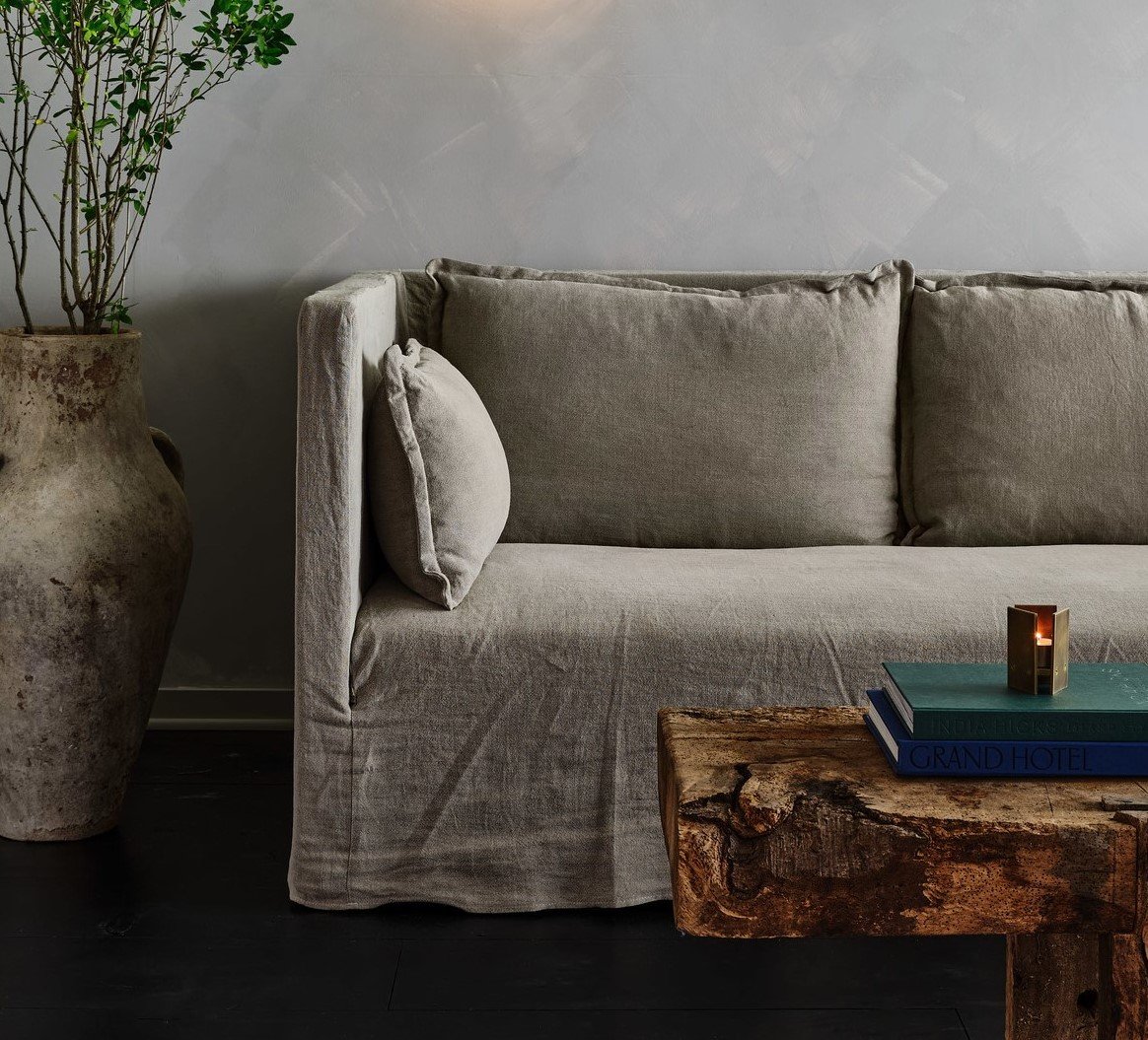 Monk Sofa placed beside a potted tree