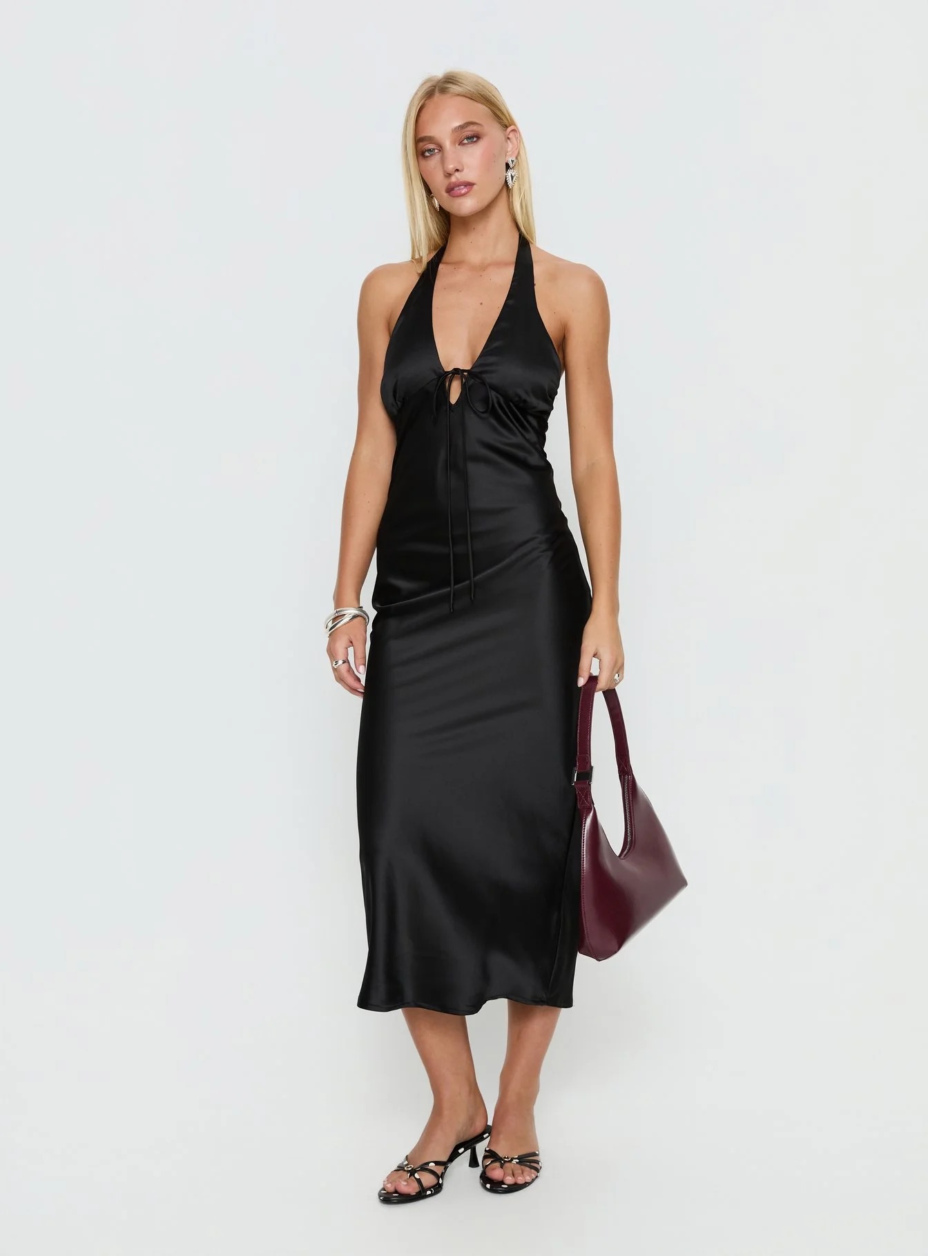 woman wearing black princess polly graduation guest dress