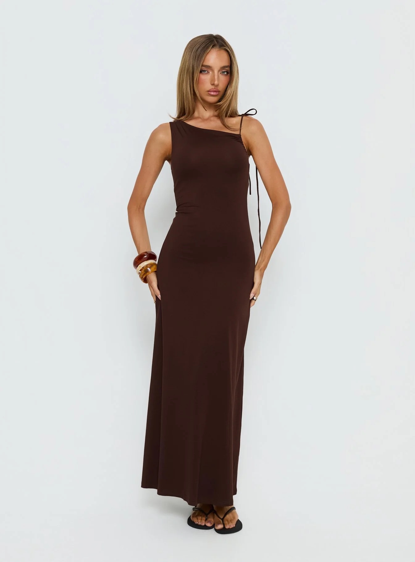 woman wearing brown princess polly graduation guest dress