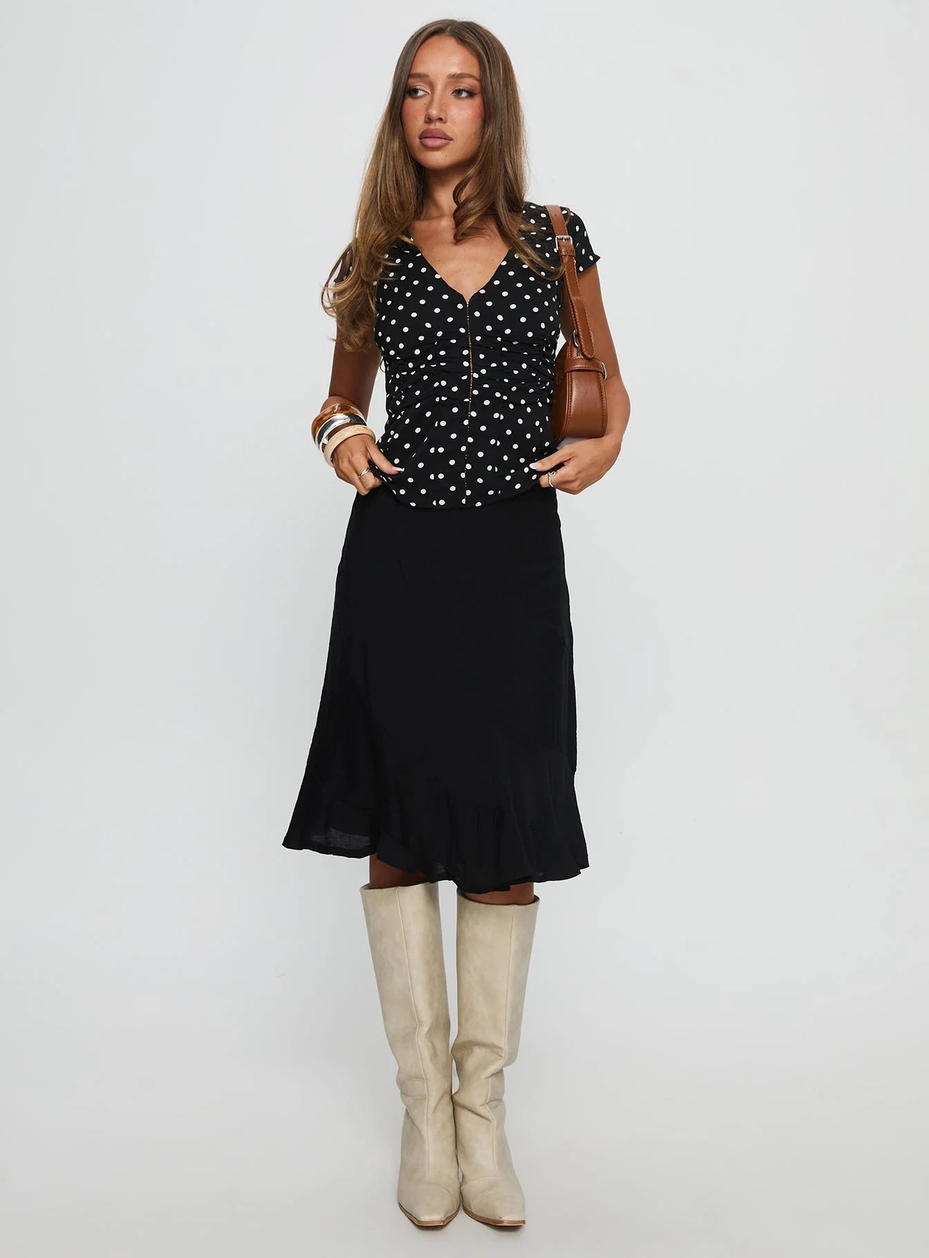 woman wearing princess polly graduation guest skirt & blouse