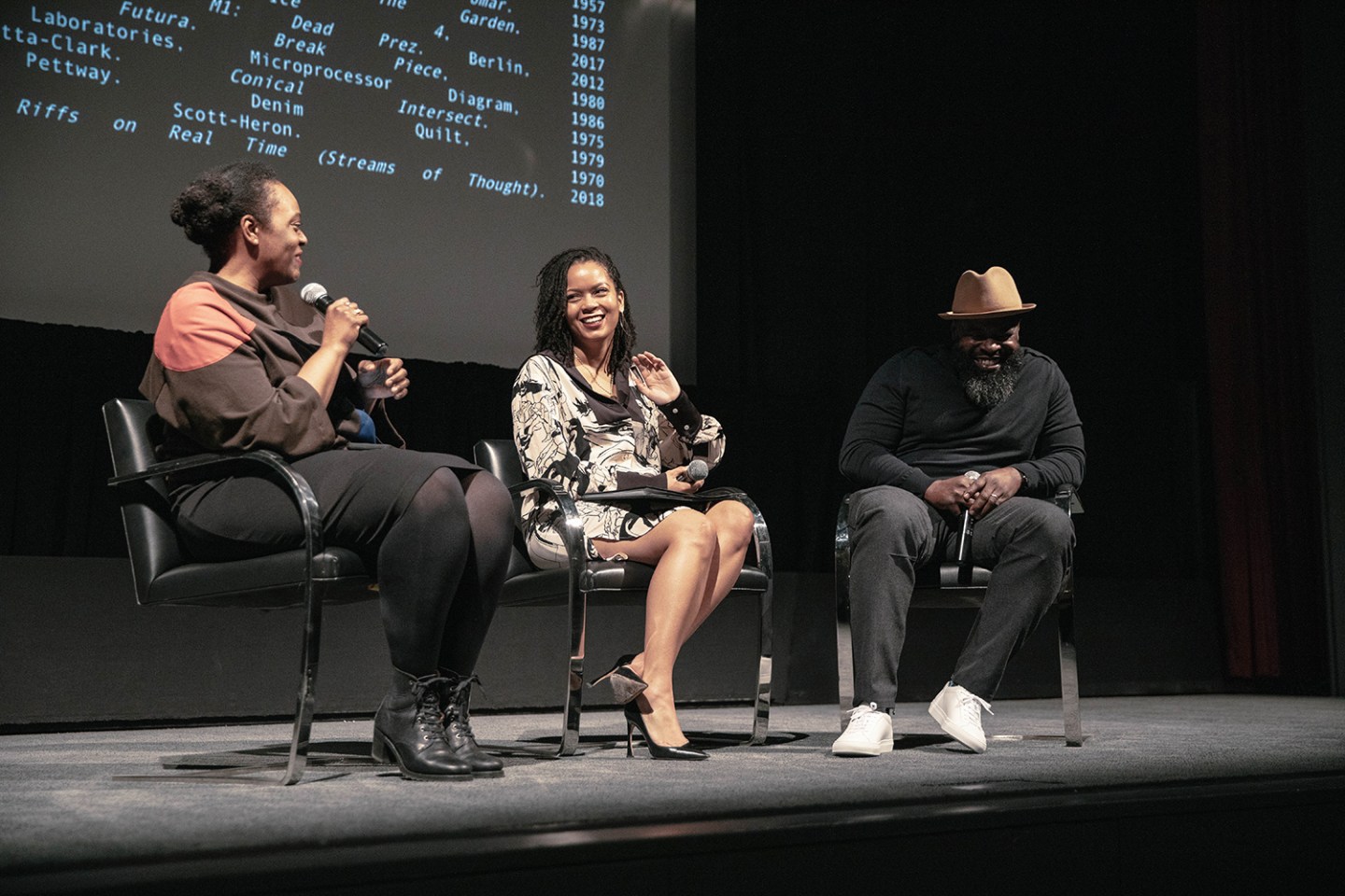 Jasmine Martin (center) moderates a conversation between artists Leslie Hewitt (left) and Black Thought (right) for The Museum of Modern Art, November 2018. Image by Artmurri
