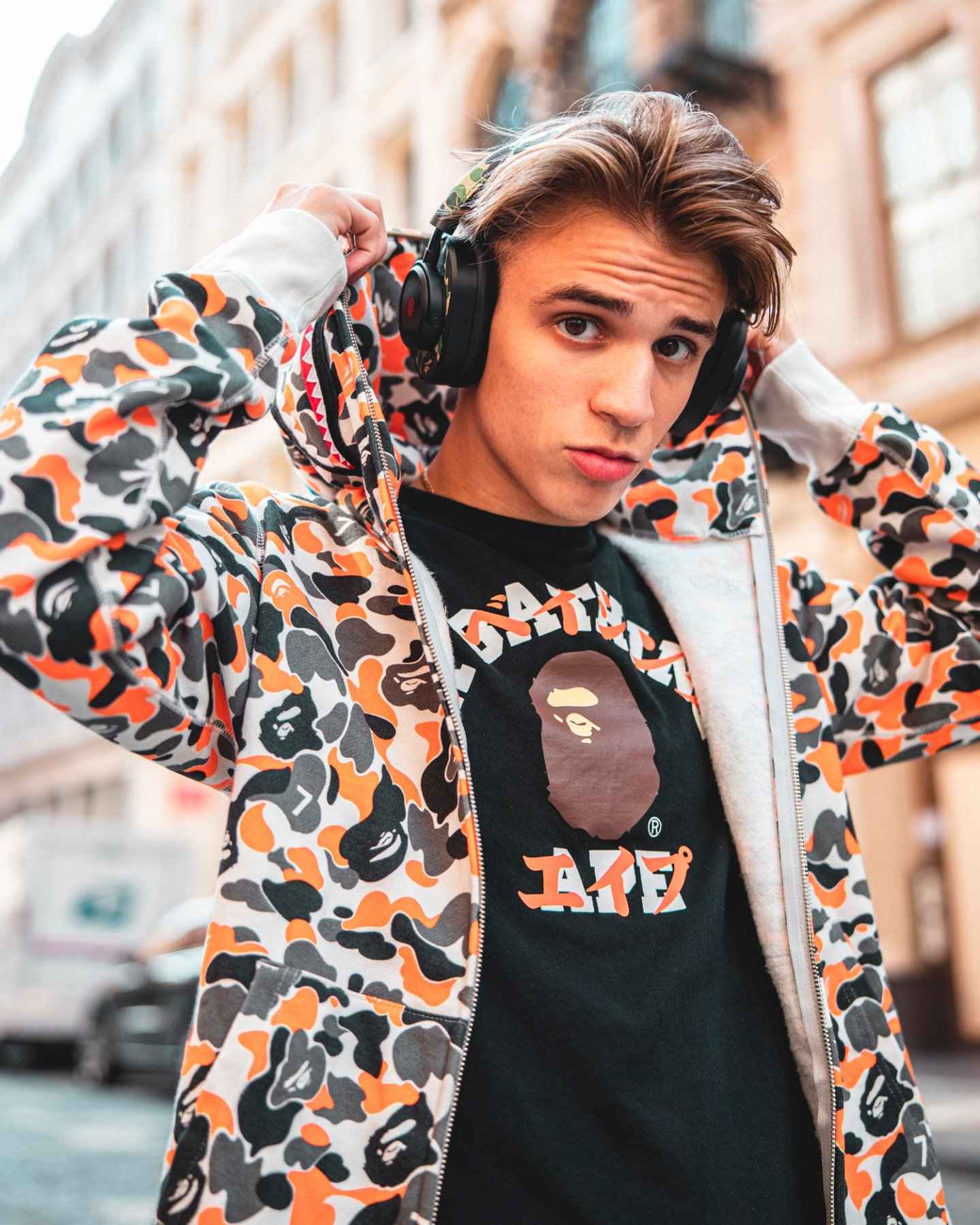 Photograph of Giancarlo Purch of Blazendary wearing BAPE MW65 Active Noise-Cancelling True Wireless Headphones