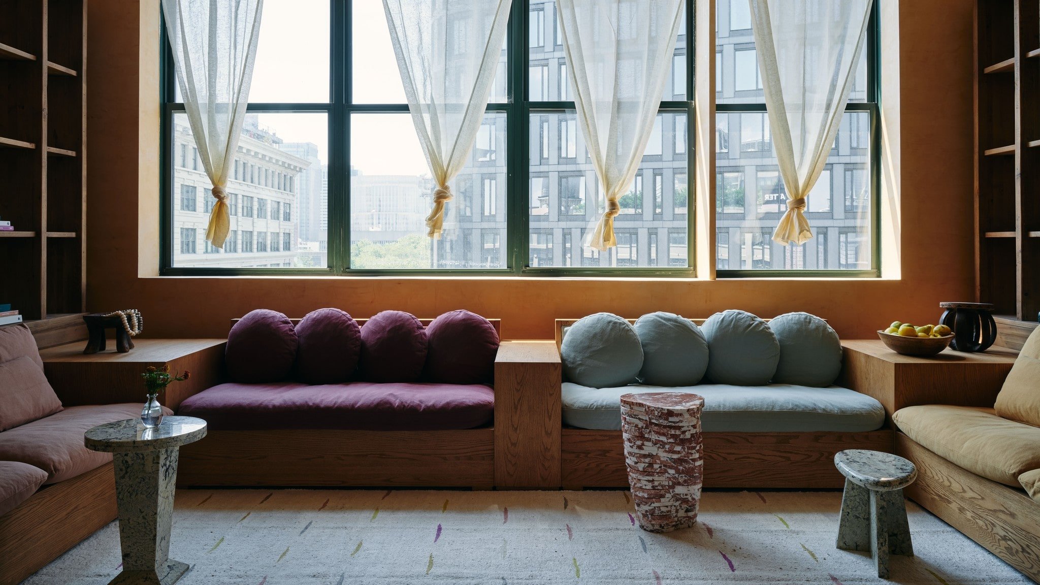 Custom Olea and Aria Sofas placed along all four sides of the Sixpenny Loft Rainbow Room