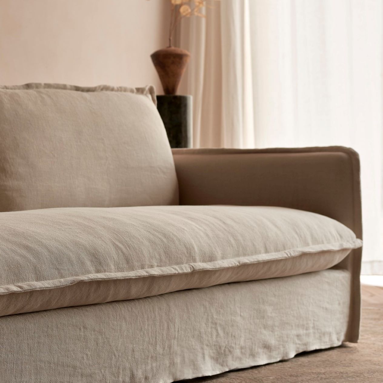 Close up of the Neva Sofa in Warm Oatmeal Medium Weight Linen