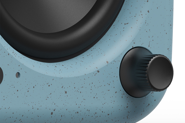 Detail view of the front panel of Kanto UKI desktop speaker in cornflower