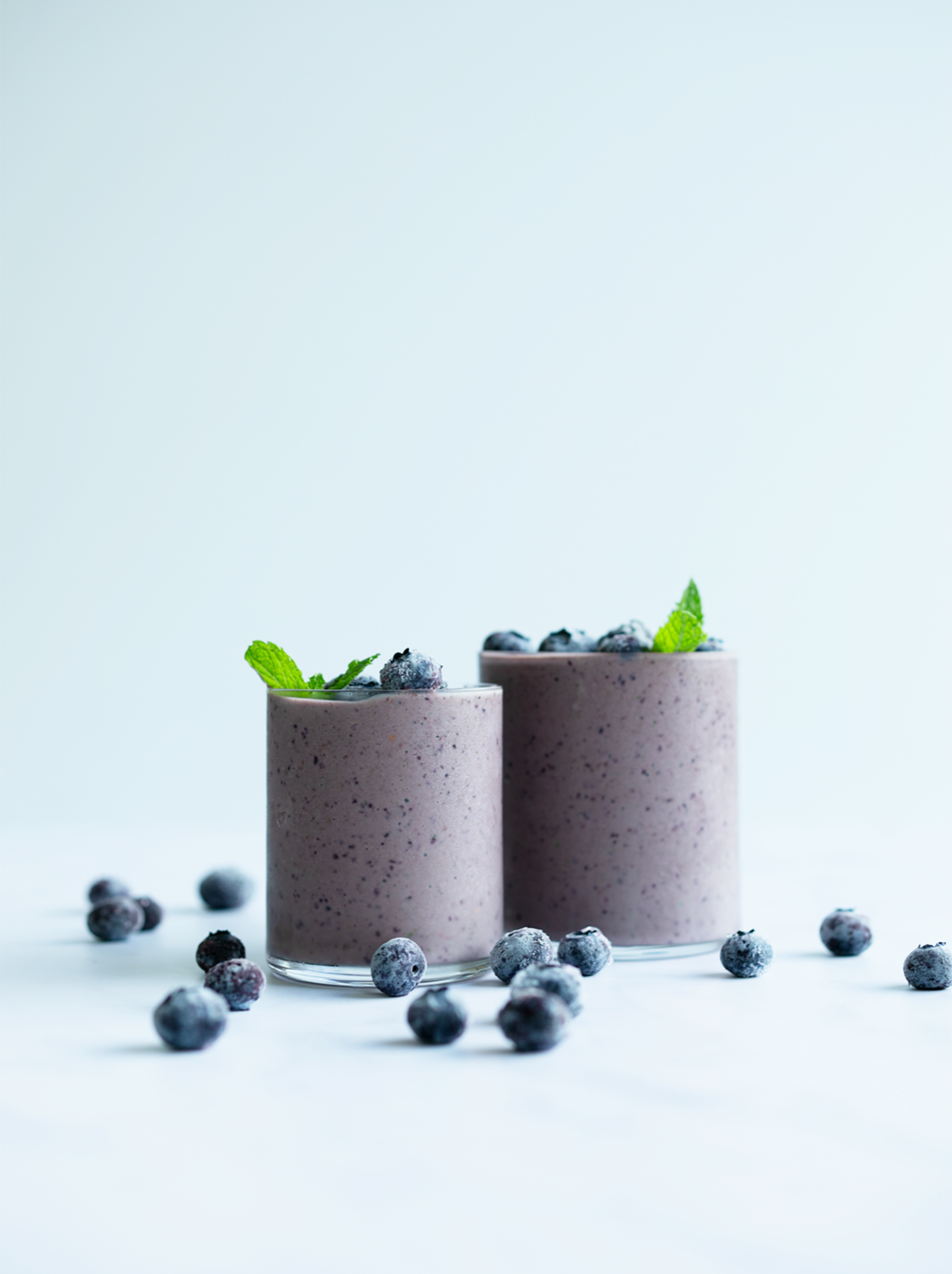 Two glasses filled with the super berry smoothie 