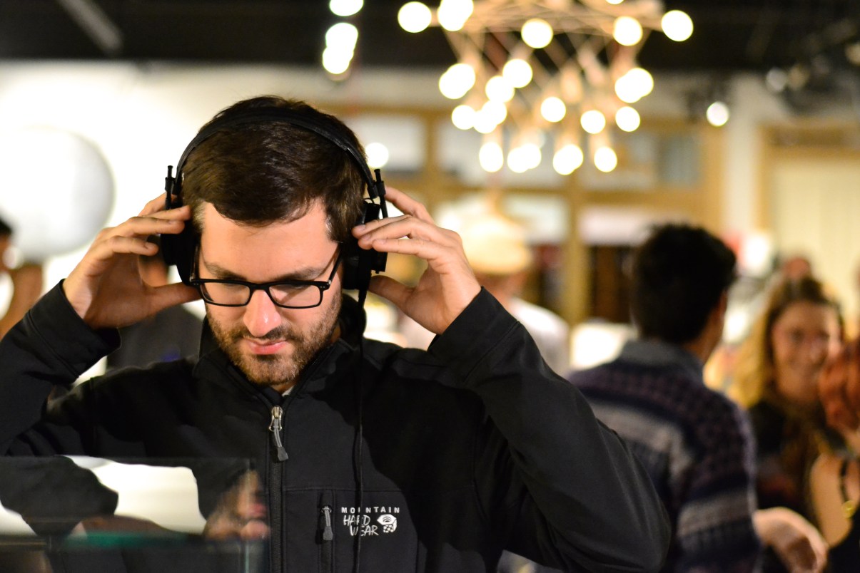 Dijital Fix and Master and Dynamic Launch Event photograph of man trying on headphones