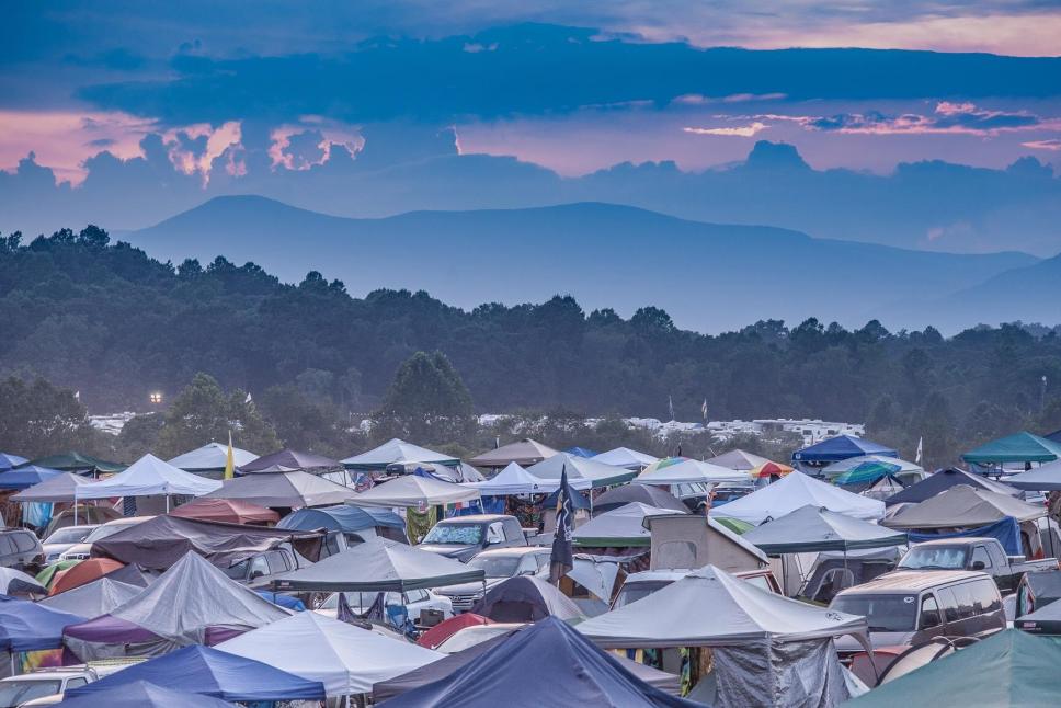 Photograph of the tents and sky at a summer music festival