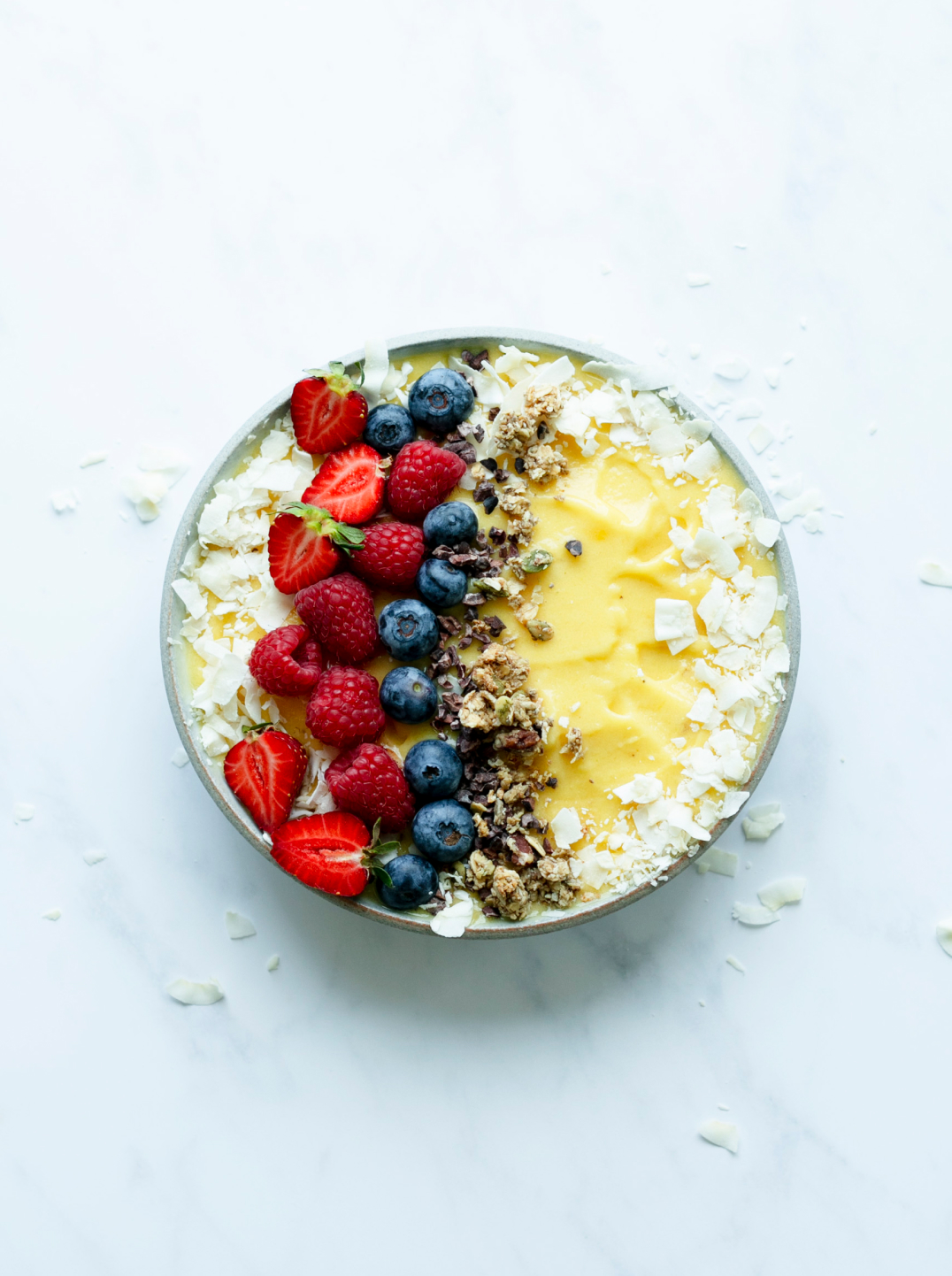 Sunshine Smoothie Bowl topped with coconut and berries