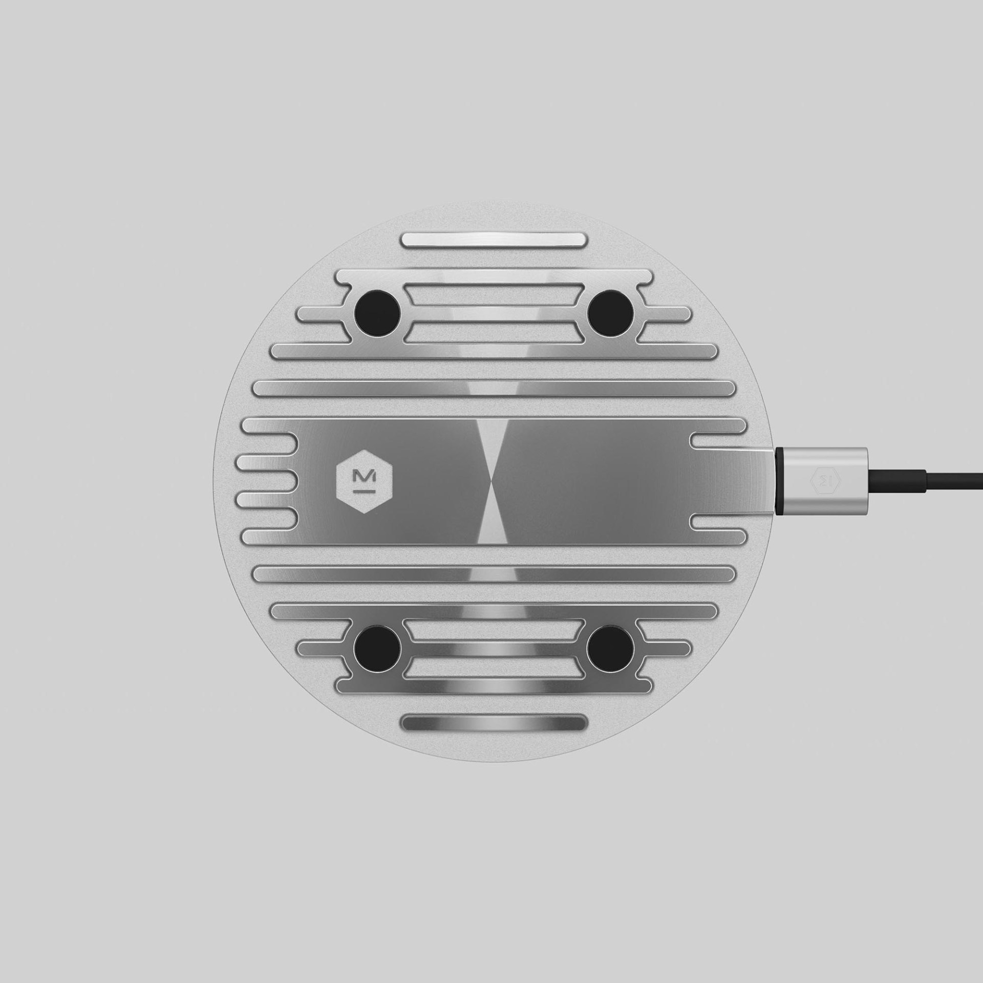 MC100 Wireless Charging Pad features the same pattern as on our original MH40 Headphones driver plates