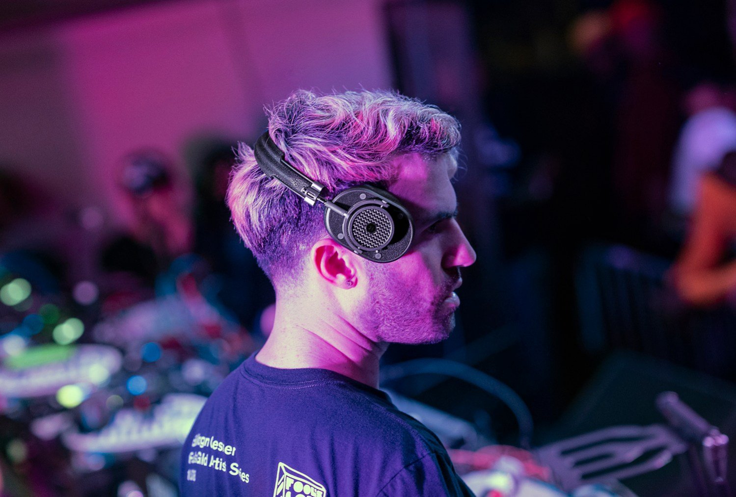 DJ A-Trak performing and wearing Master and Dynamic headphones