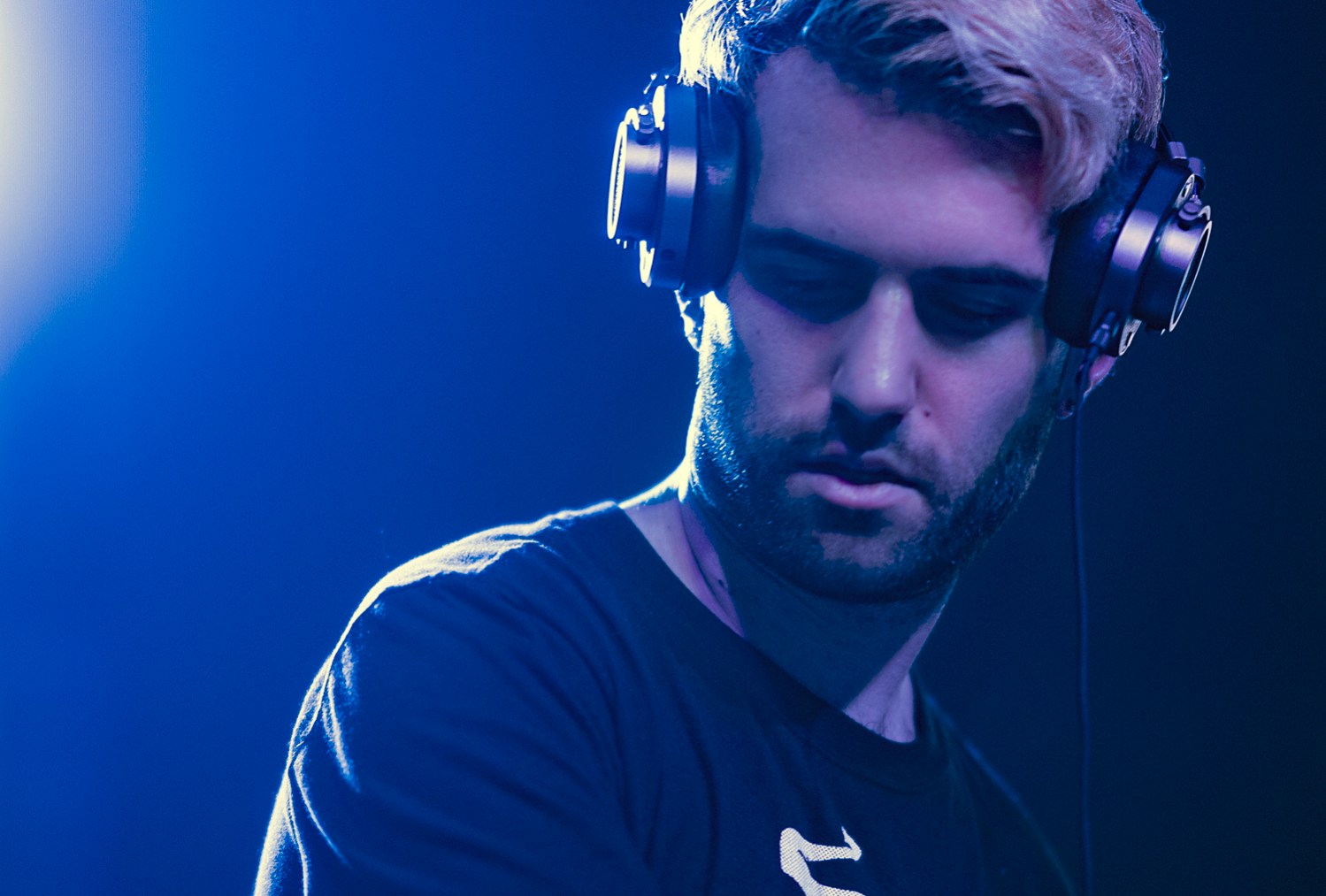 DJ A-Trak performing and wearing Master and Dynamic headphones