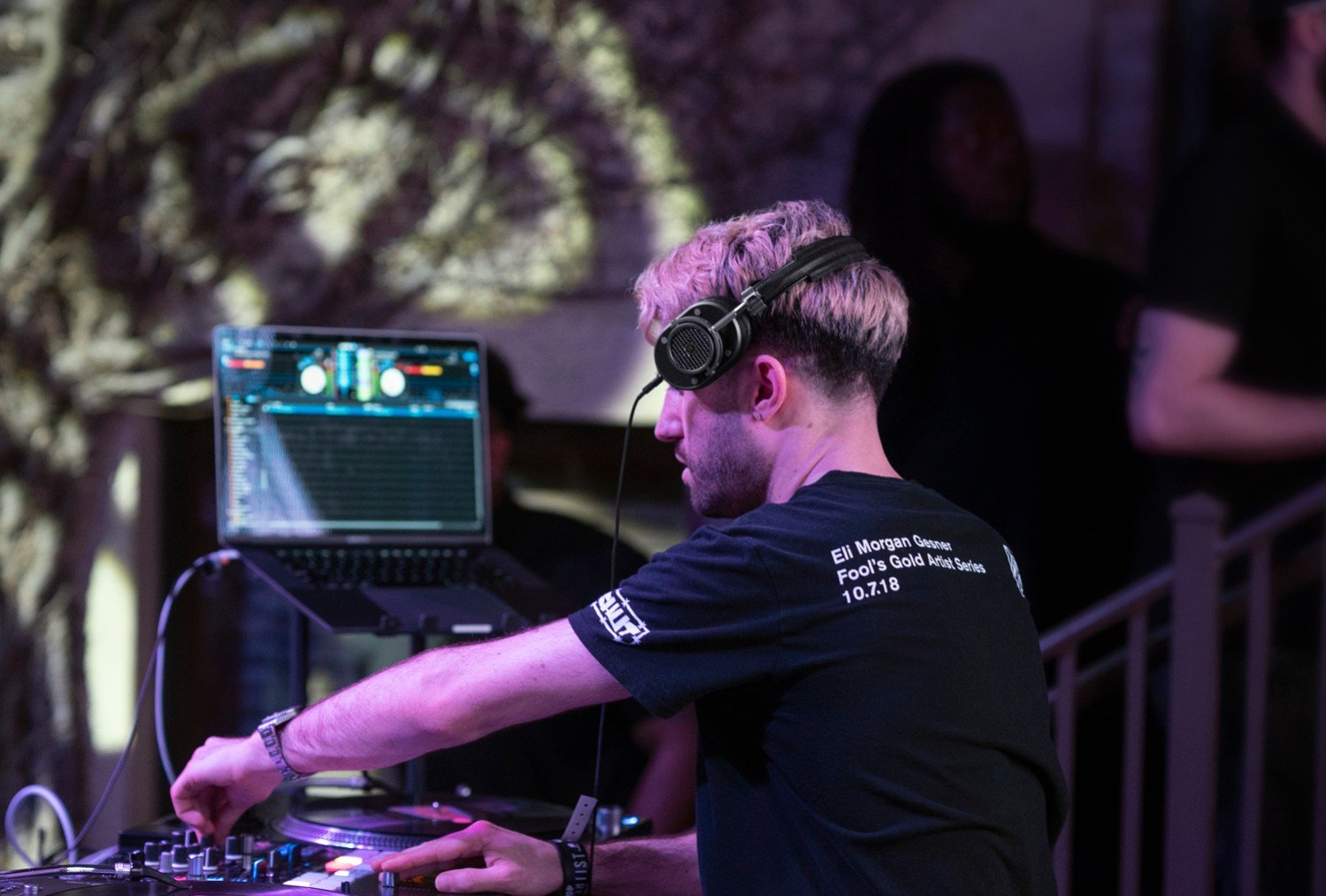 DJ A-Trak performing and wearing Master and Dynamic headphones