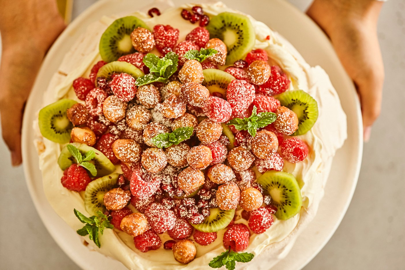 Brookfarm Pavlova with  seasonal fruits  and candied  macadamias