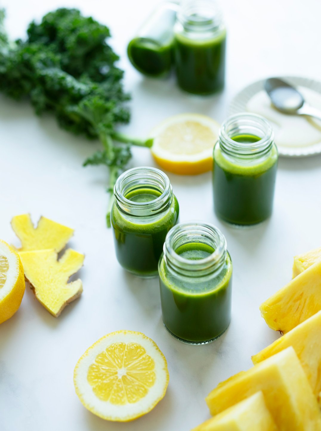 3 small bottles of allergy ease juice with ingredients.
