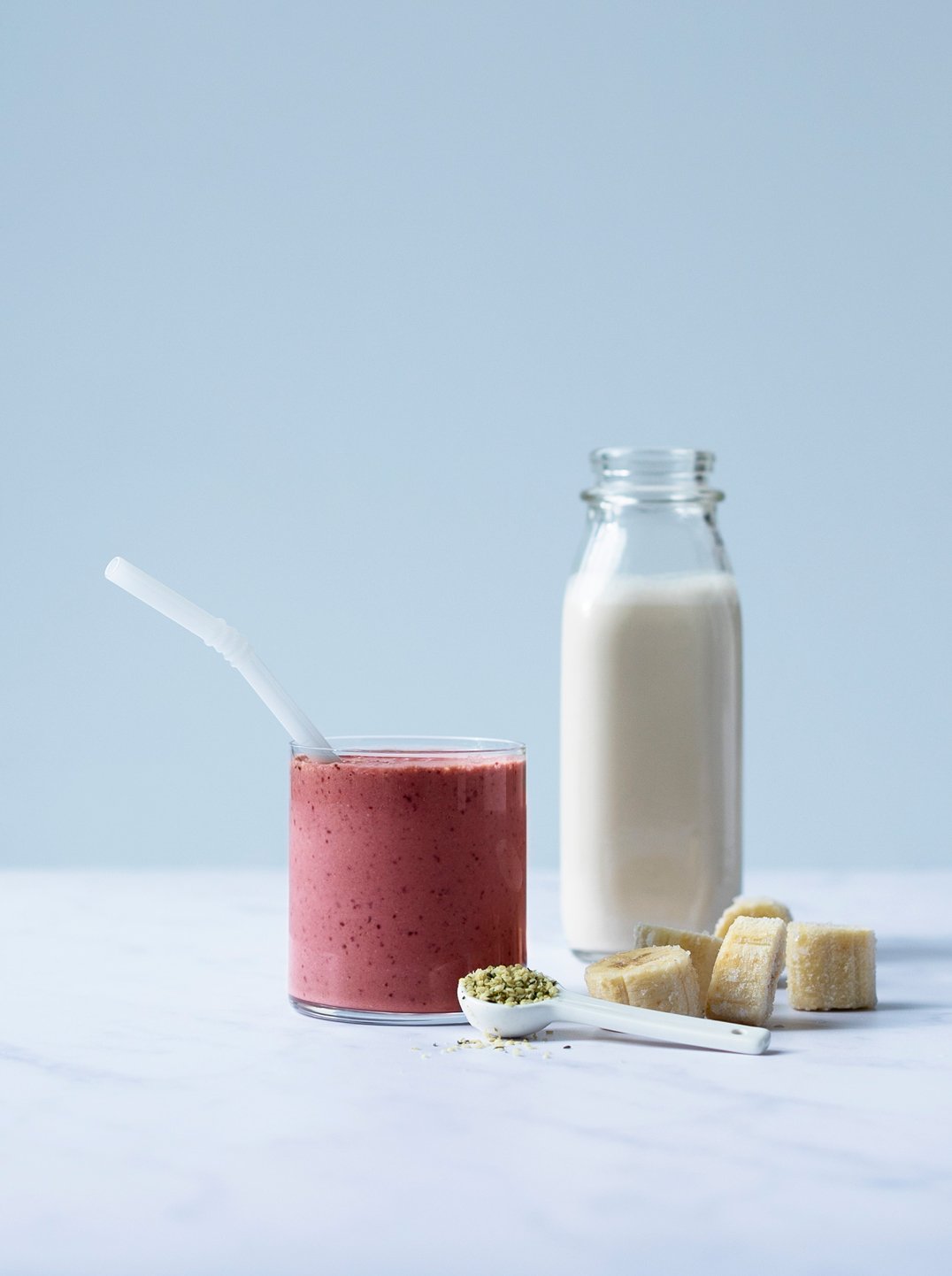 a glass of restful sleep smoothie with a straw