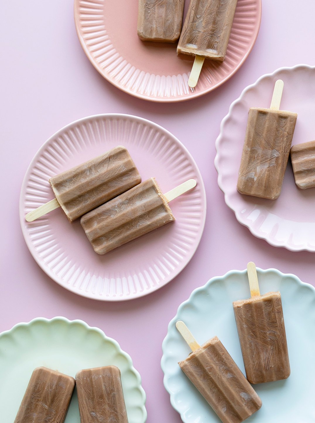 Cacao And Peanut Butter Fudgesicles on multi colored plates
