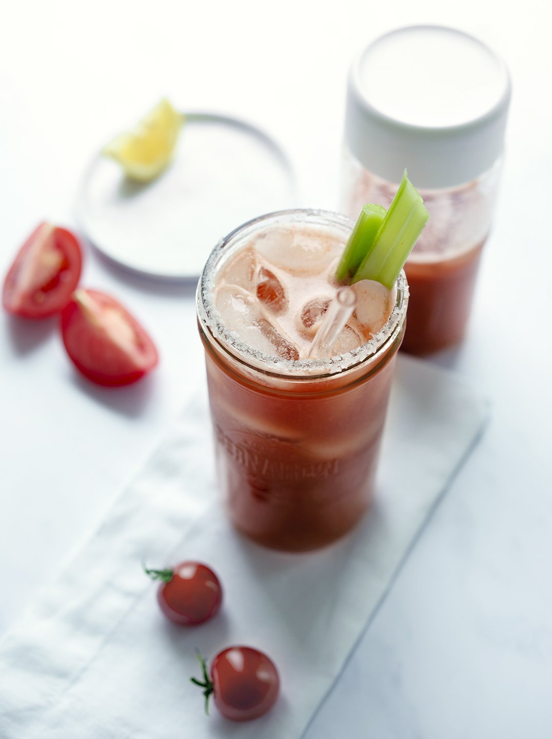 two glass bottles with spicy bloody mary