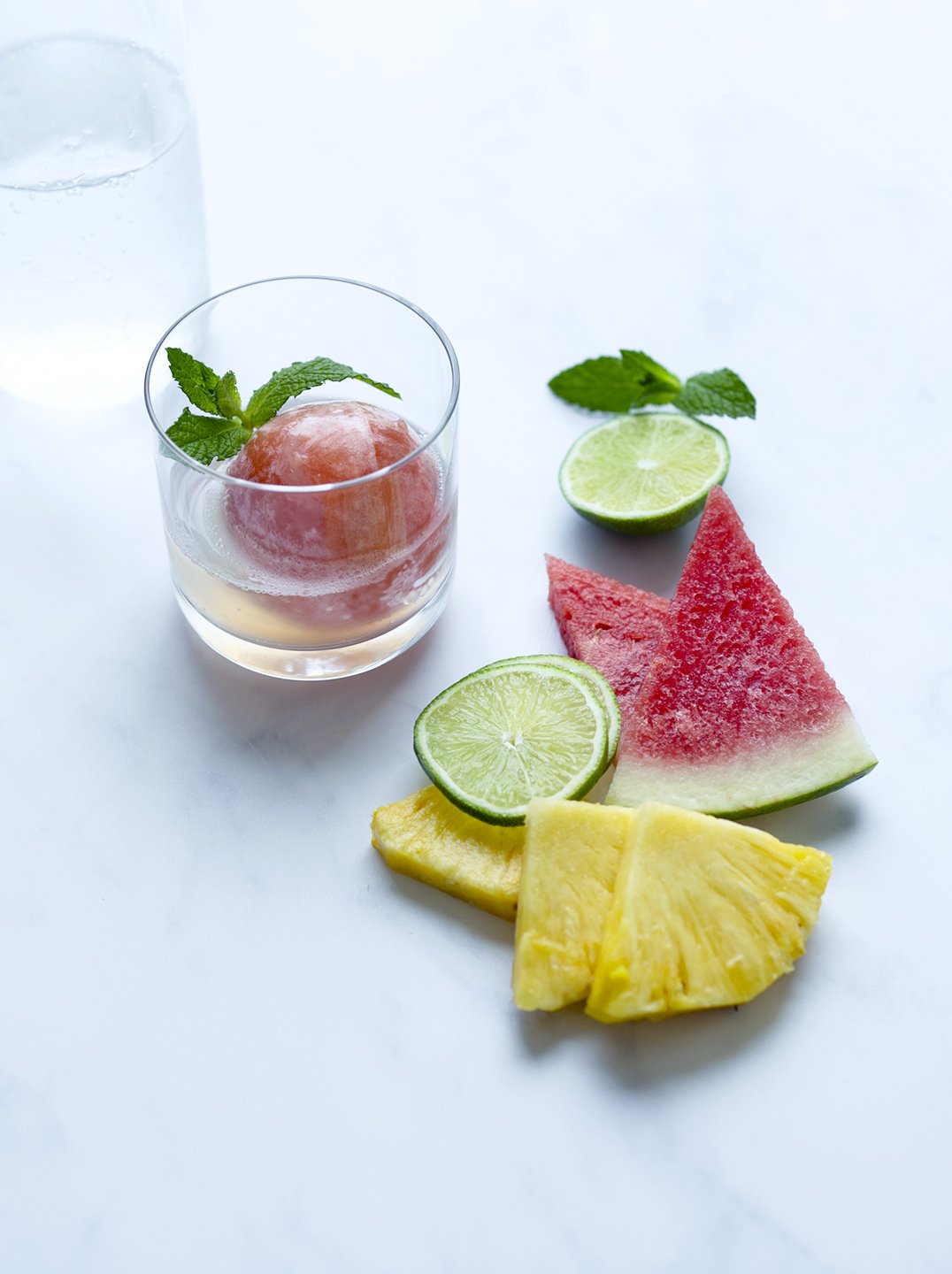 a glass of tropical mint refresher with ingredients