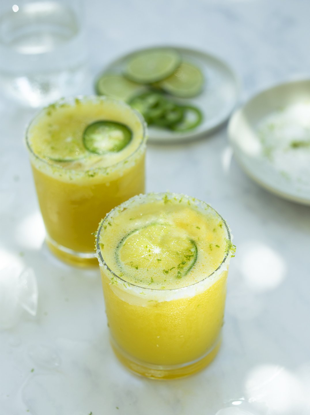 2 glasses of spicy mango margarita