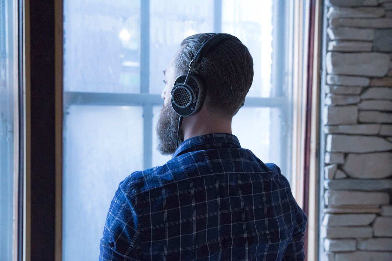 Lifestyle image of Blue For Master and Dynamic looking out of the window