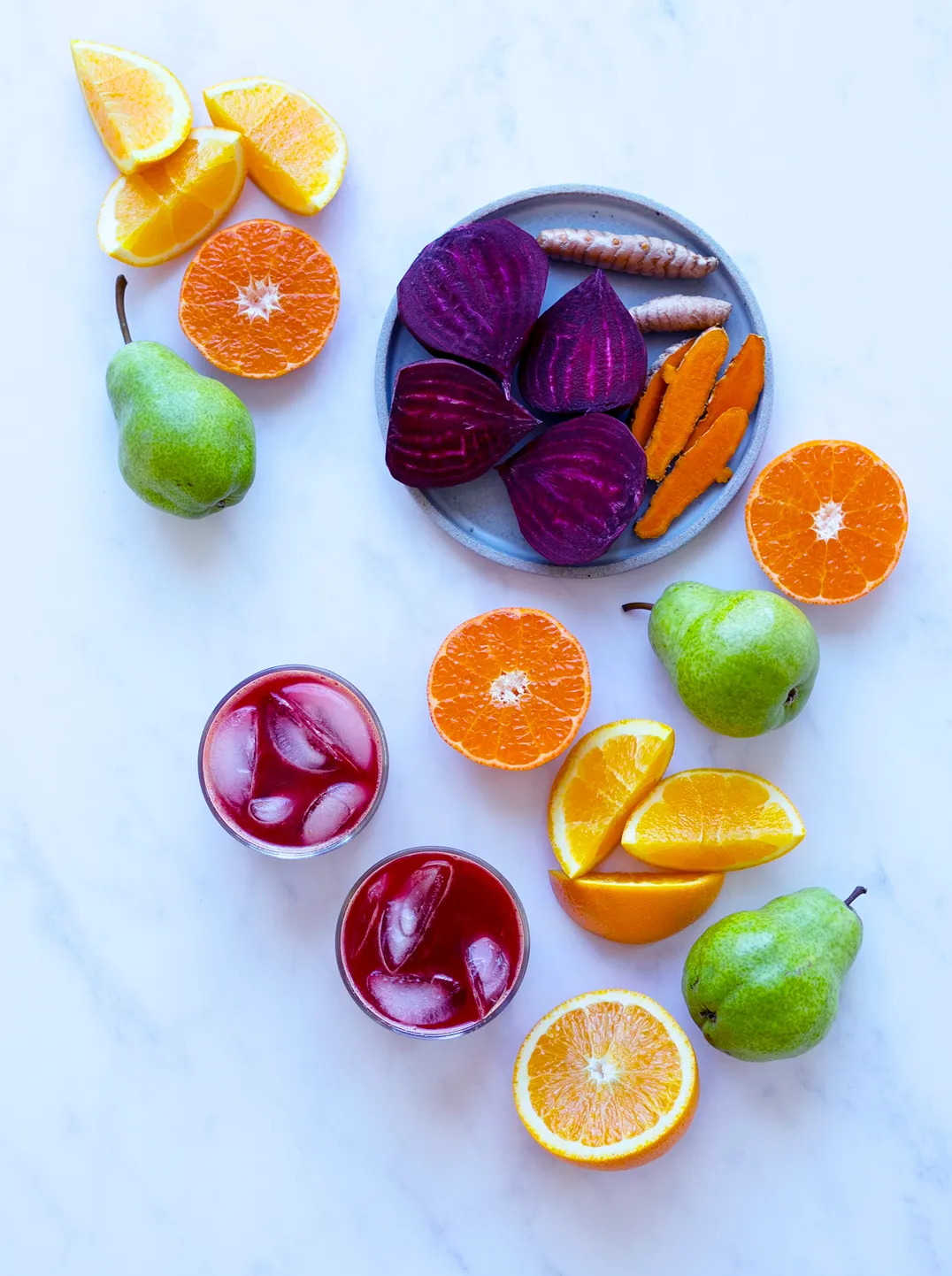 2 glasses of red sunrise juice with ingredients