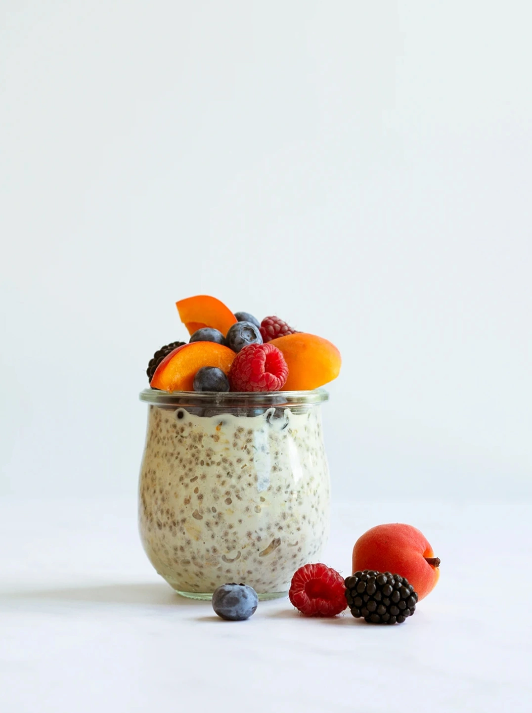 a jar of overnight oats topped with fruit