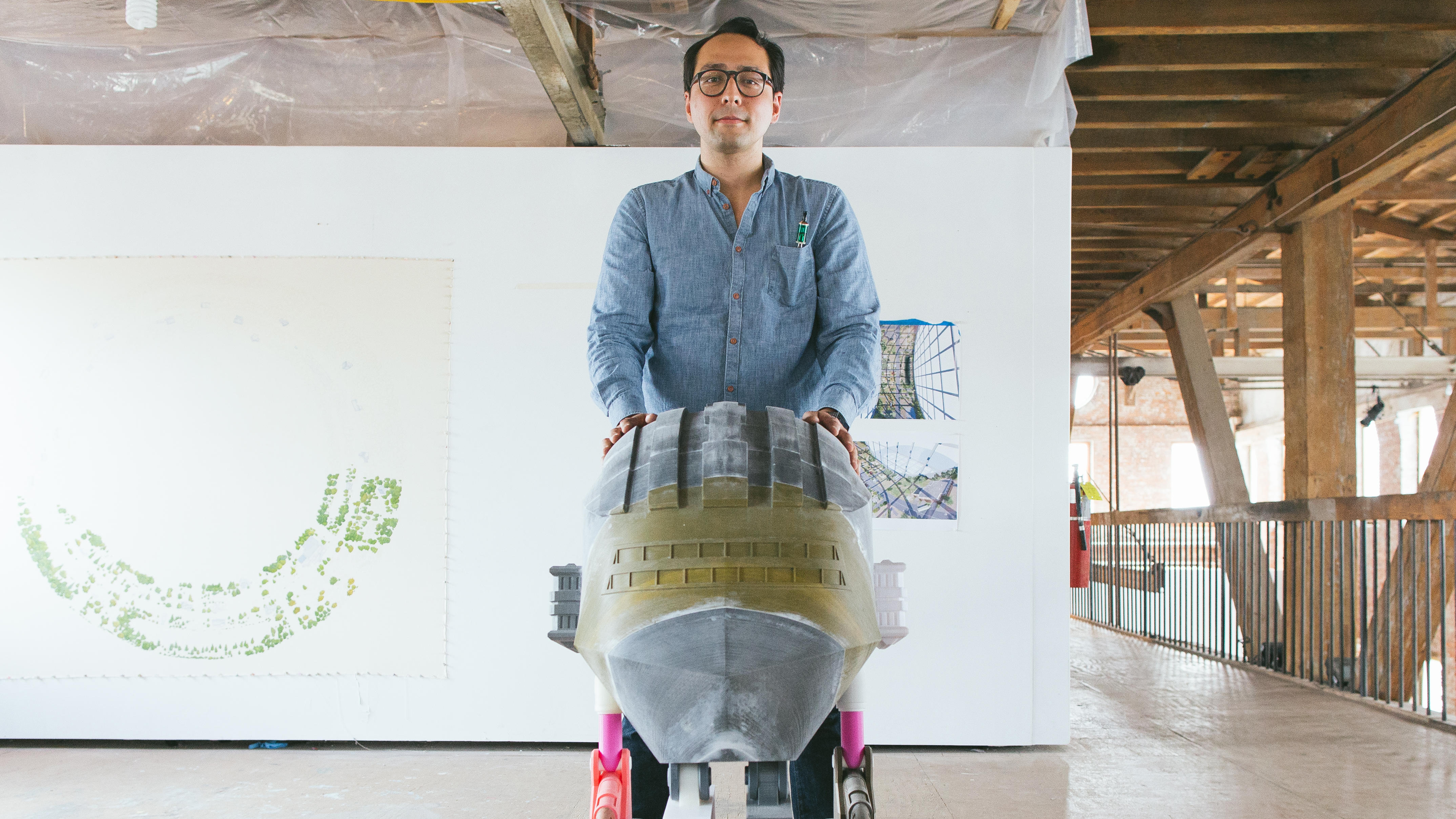 Micah Ganske with one of his futuristic sculptures to be featured in his first solo show, “The Future Is Always Tomorrow”