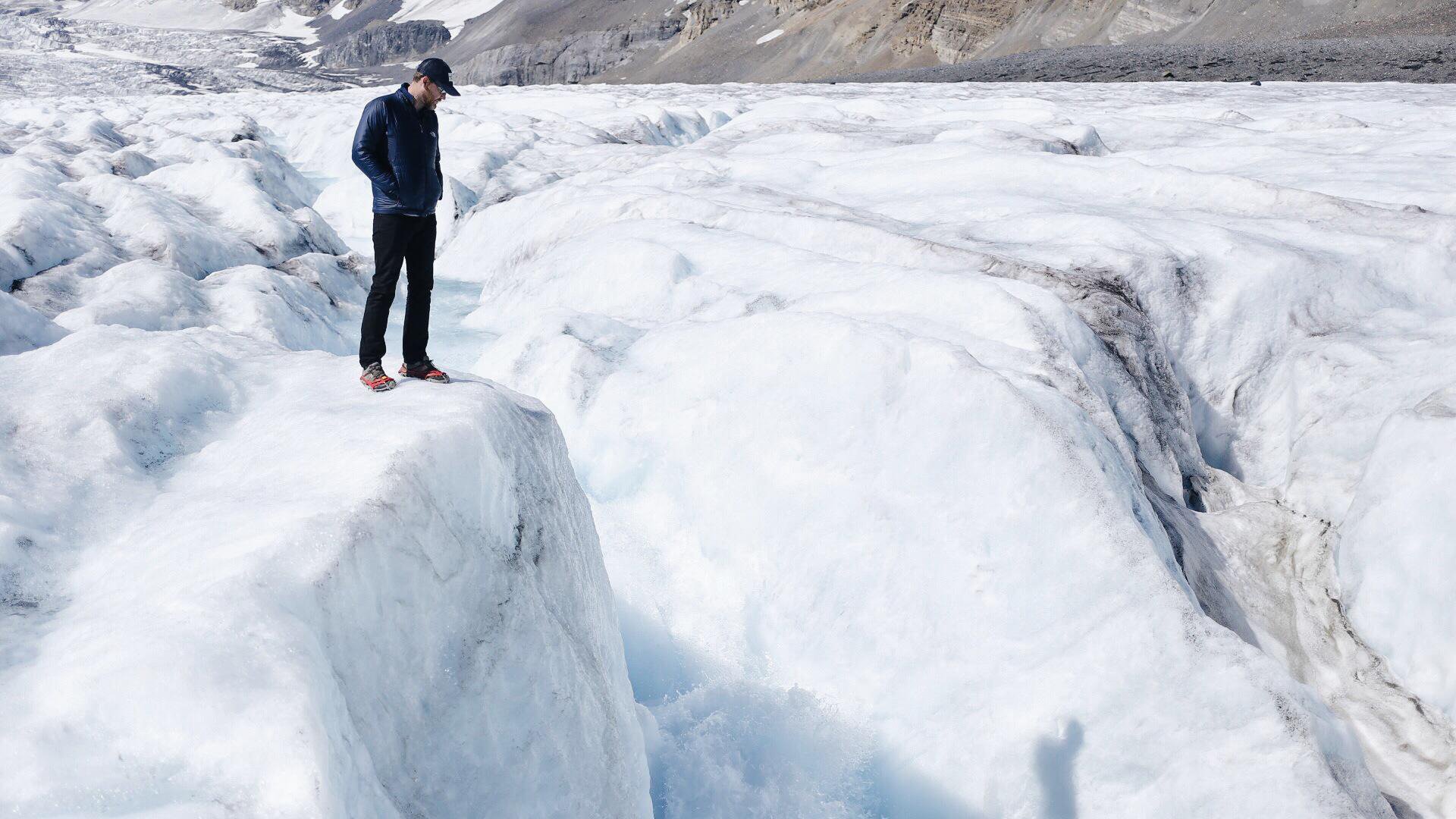 Tyson stands on the Athabasca Glacier in Alberta, Canada, a natural wonder that is retreating at an average rate of ten meters a year.
