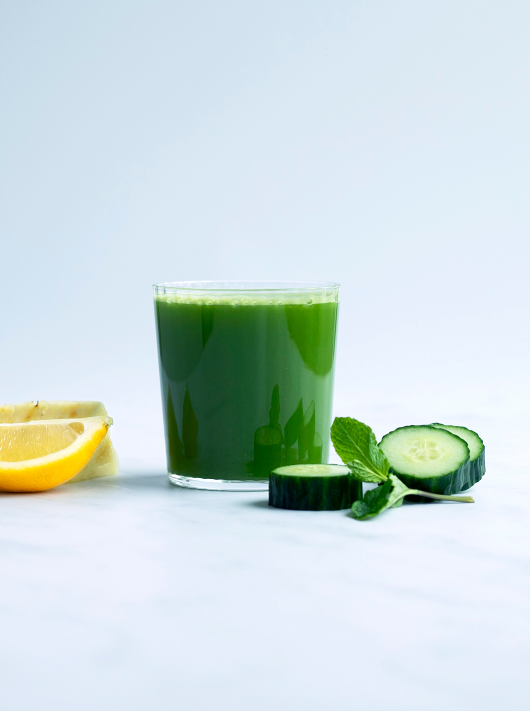 a glass of winter green juice