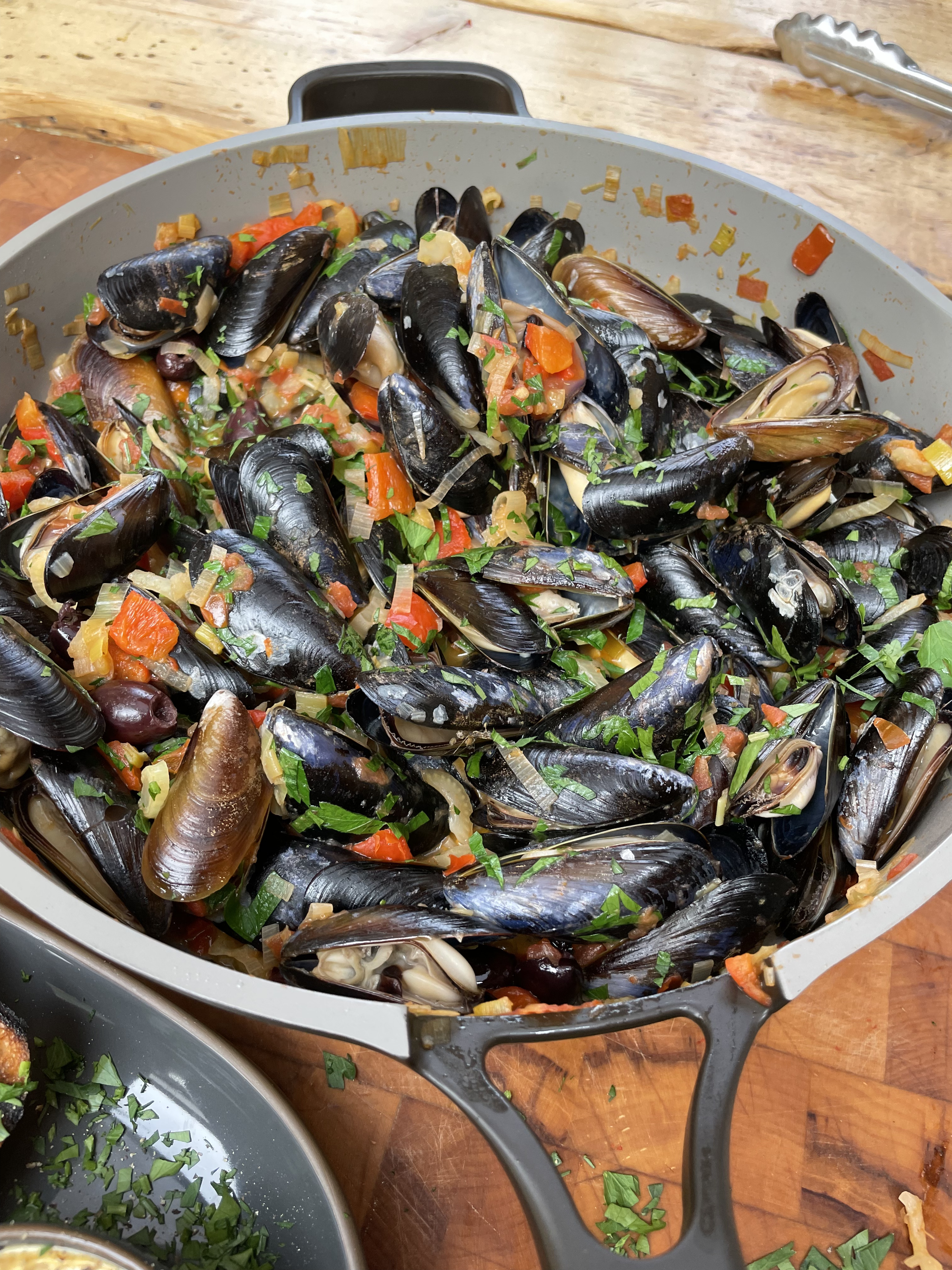 mussels in tomato stew cooking in always pan