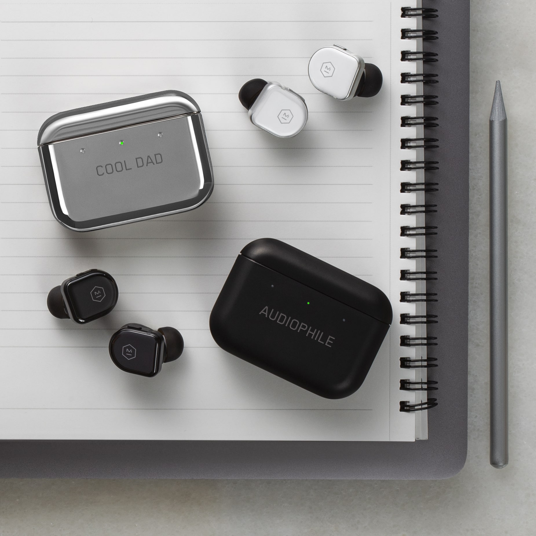 MW08 True Wireless Earphones in Black Ceramic and White Ceramic with engraved charging cases. 