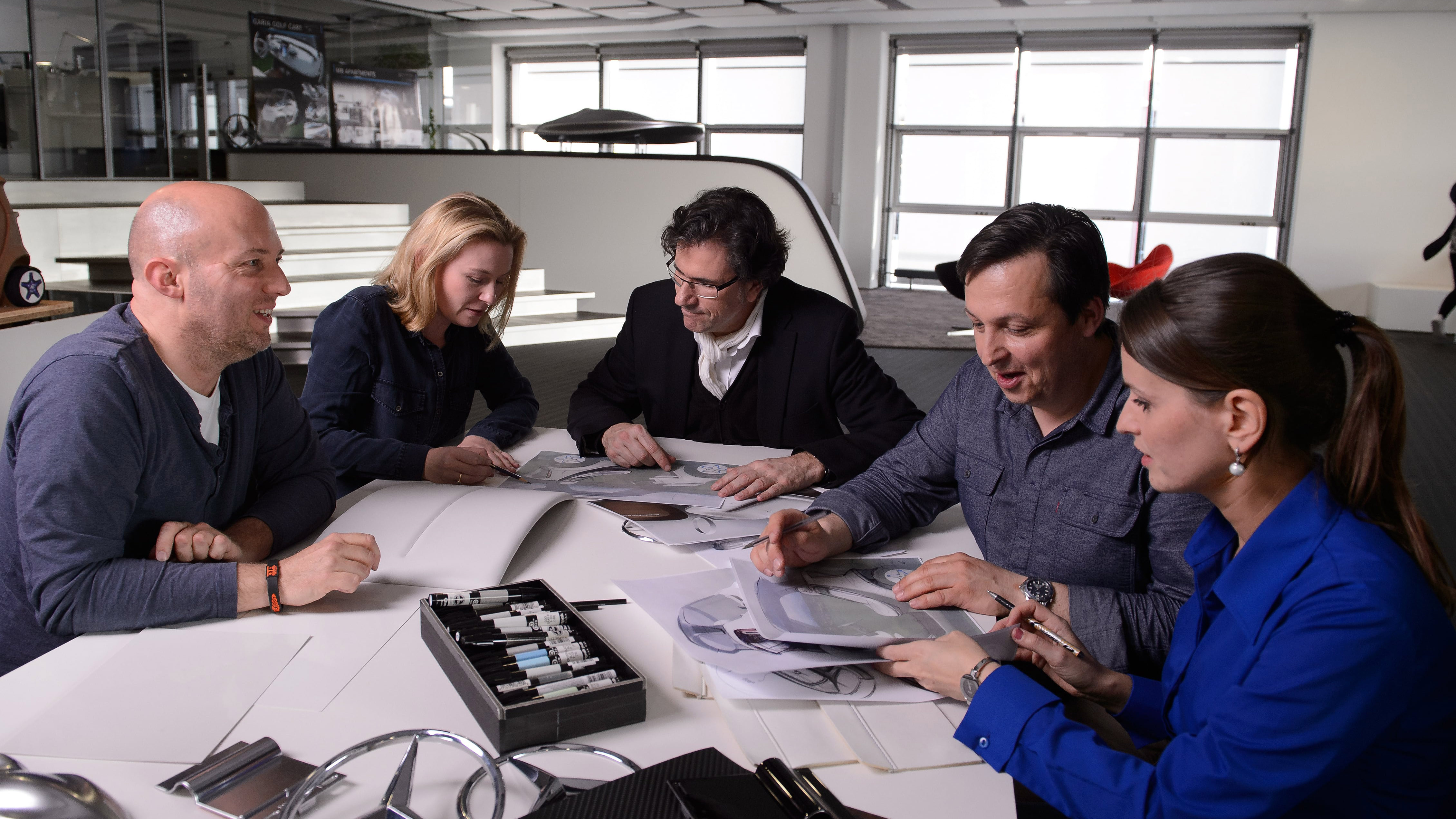 Martin Bremer (center) leads the Creation Brand Experience team for Mercedes-Benz Group.