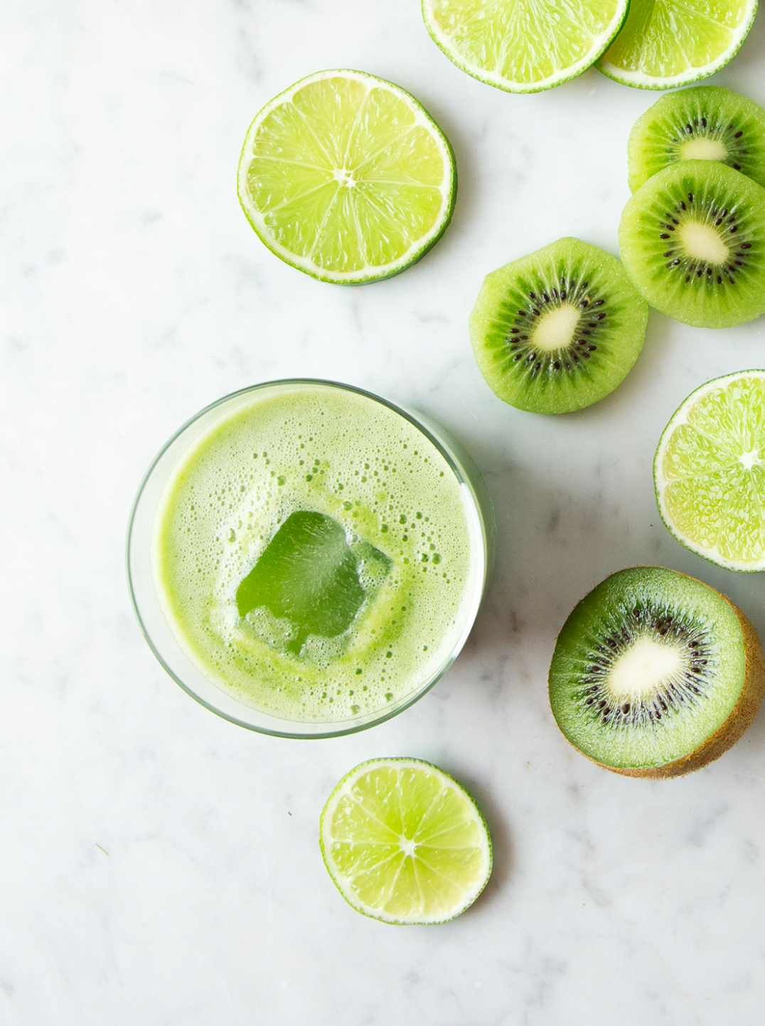 a glass of sweet cucumber cooler with lime and kiwi