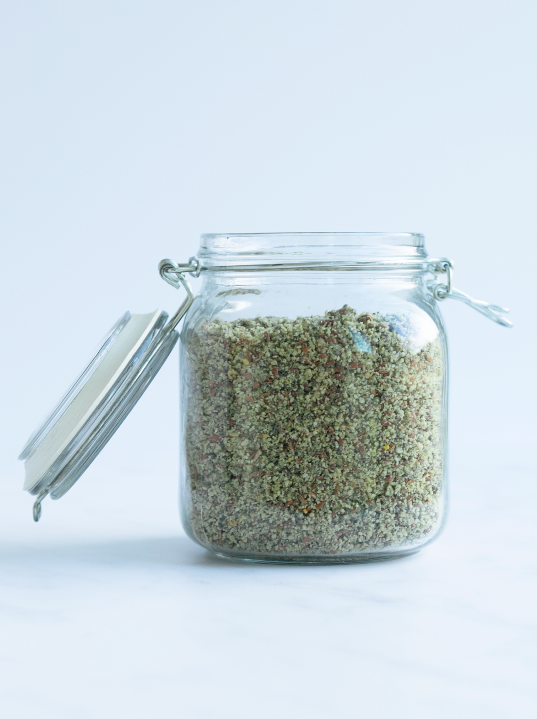 a glass jar filled with homemade protein powder