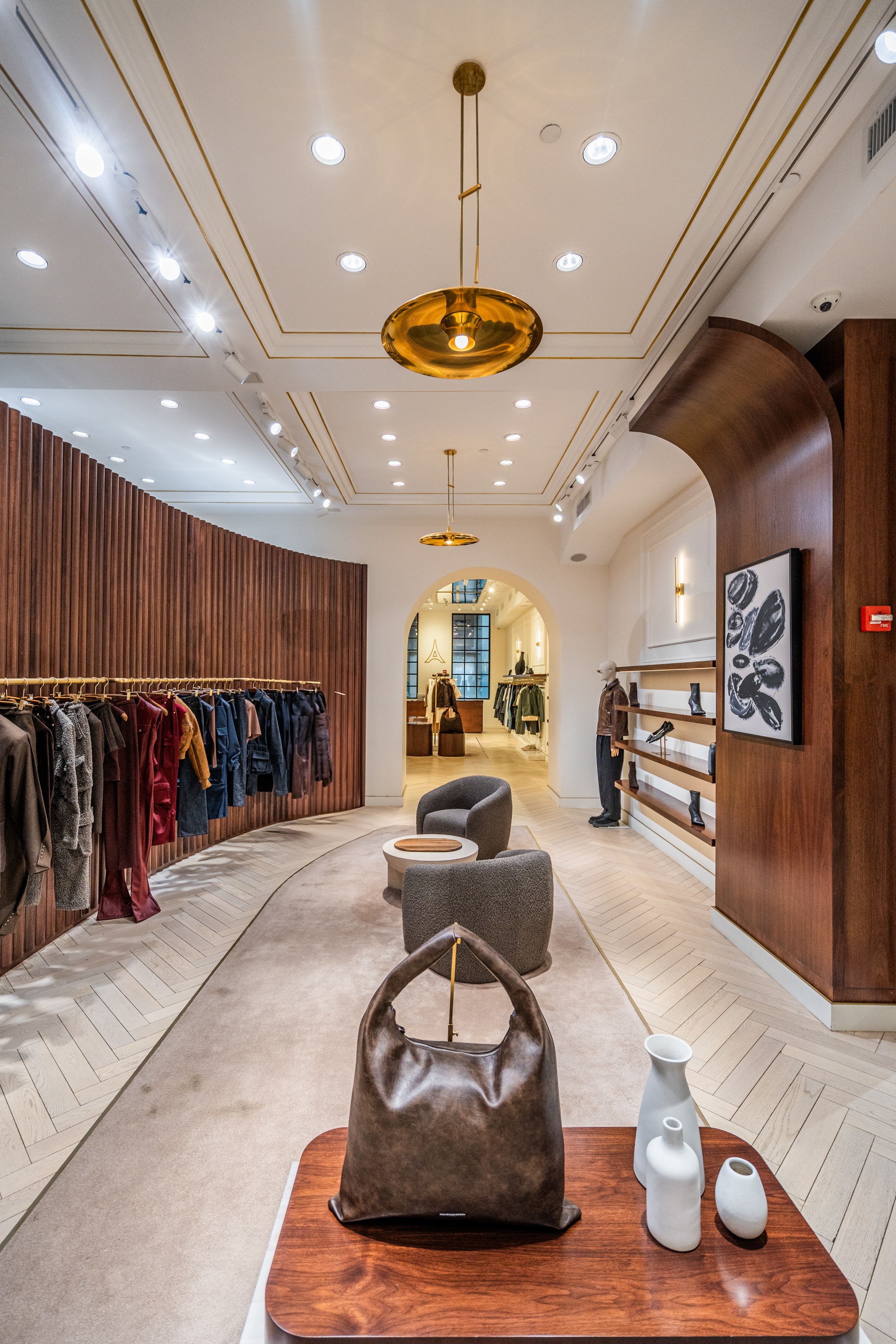 Premium wide-plank hardwood floors by PID Floors enhancing Maniere de Voir luxury retail interior