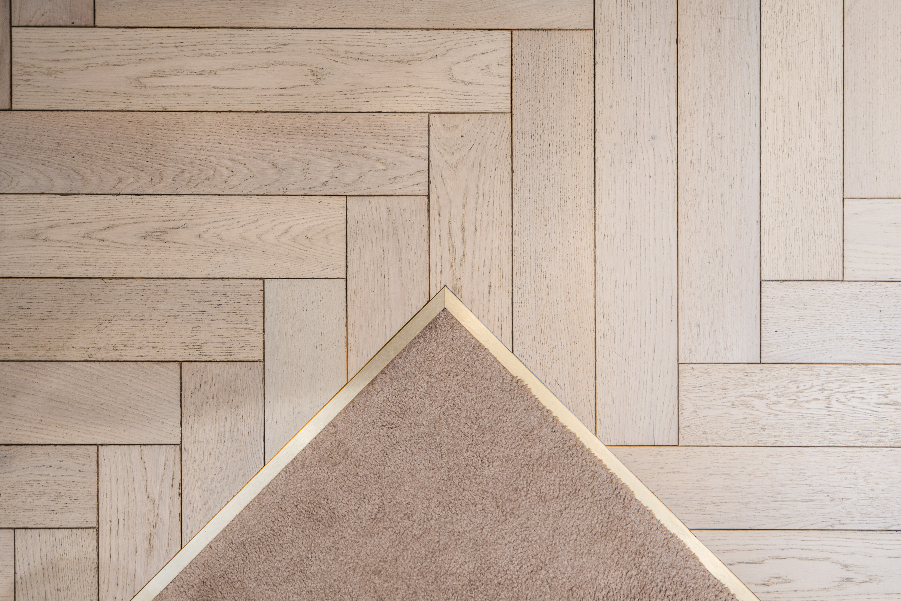 Close-up of PID Floors luxury hardwood plank detailing at Maniere de Voir commercial space