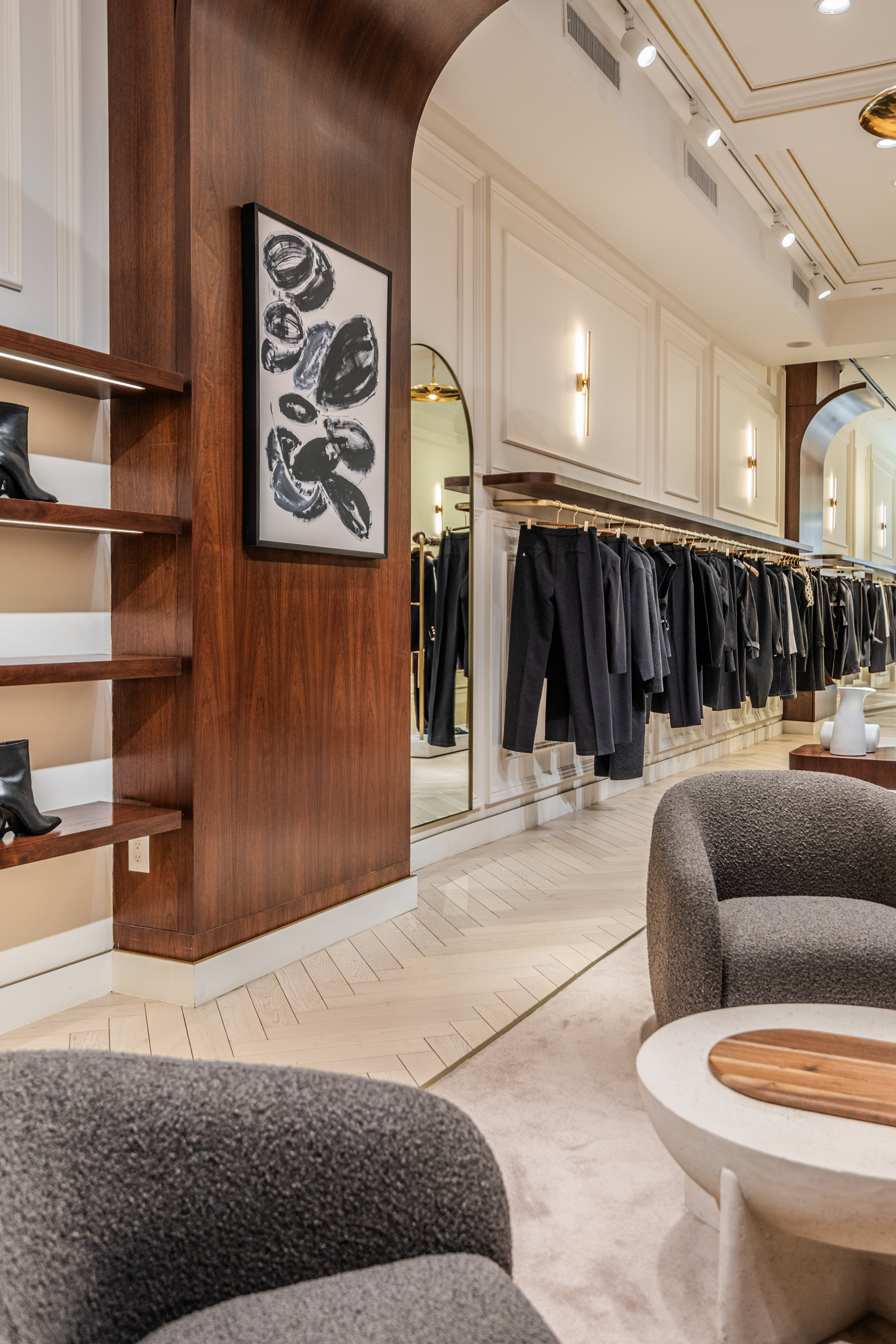 Premium hardwood floors by PID Floors reflecting lighting at Maniere de Voir NYC retail boutique